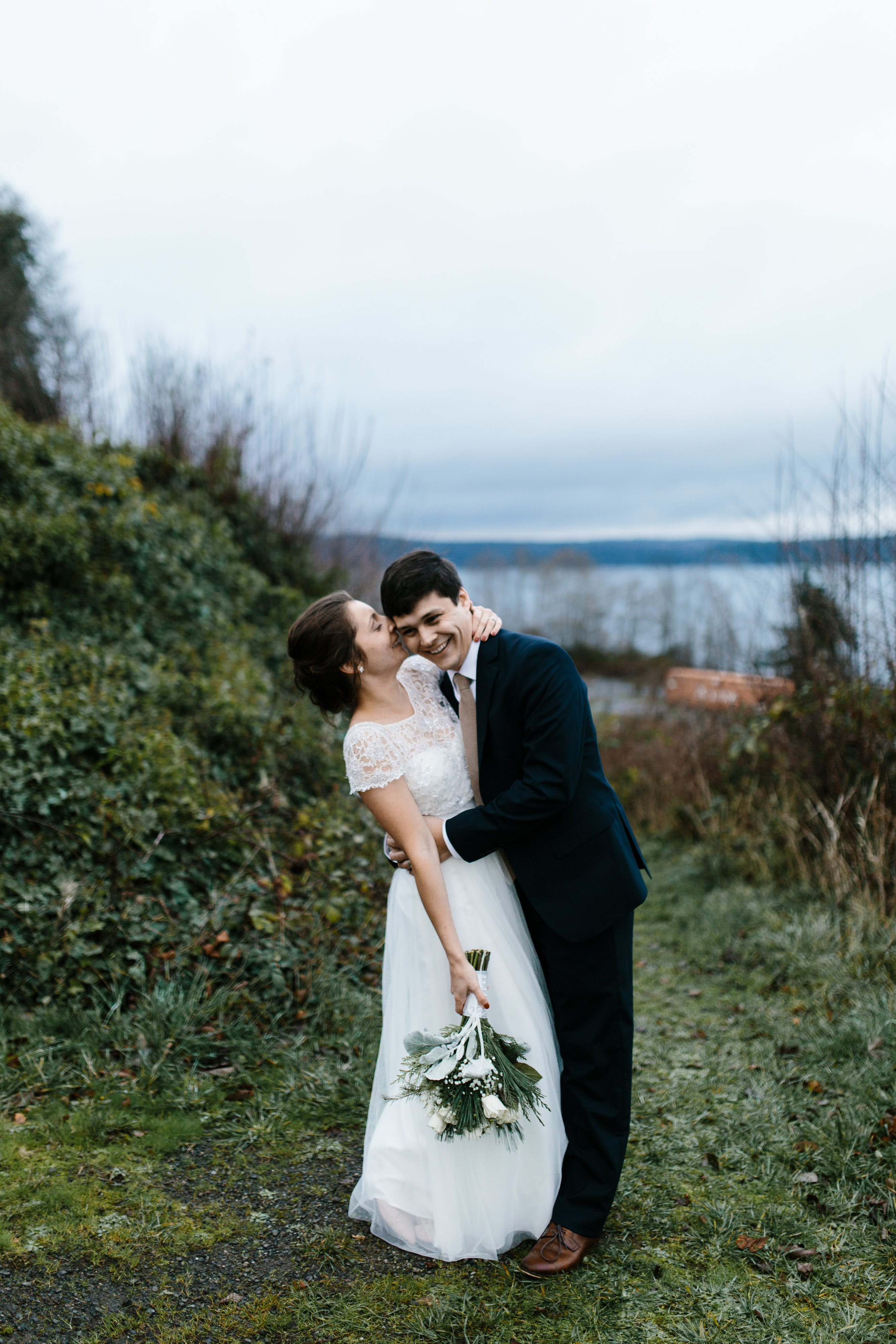 bride and groom laughing at winter wedding port gamble