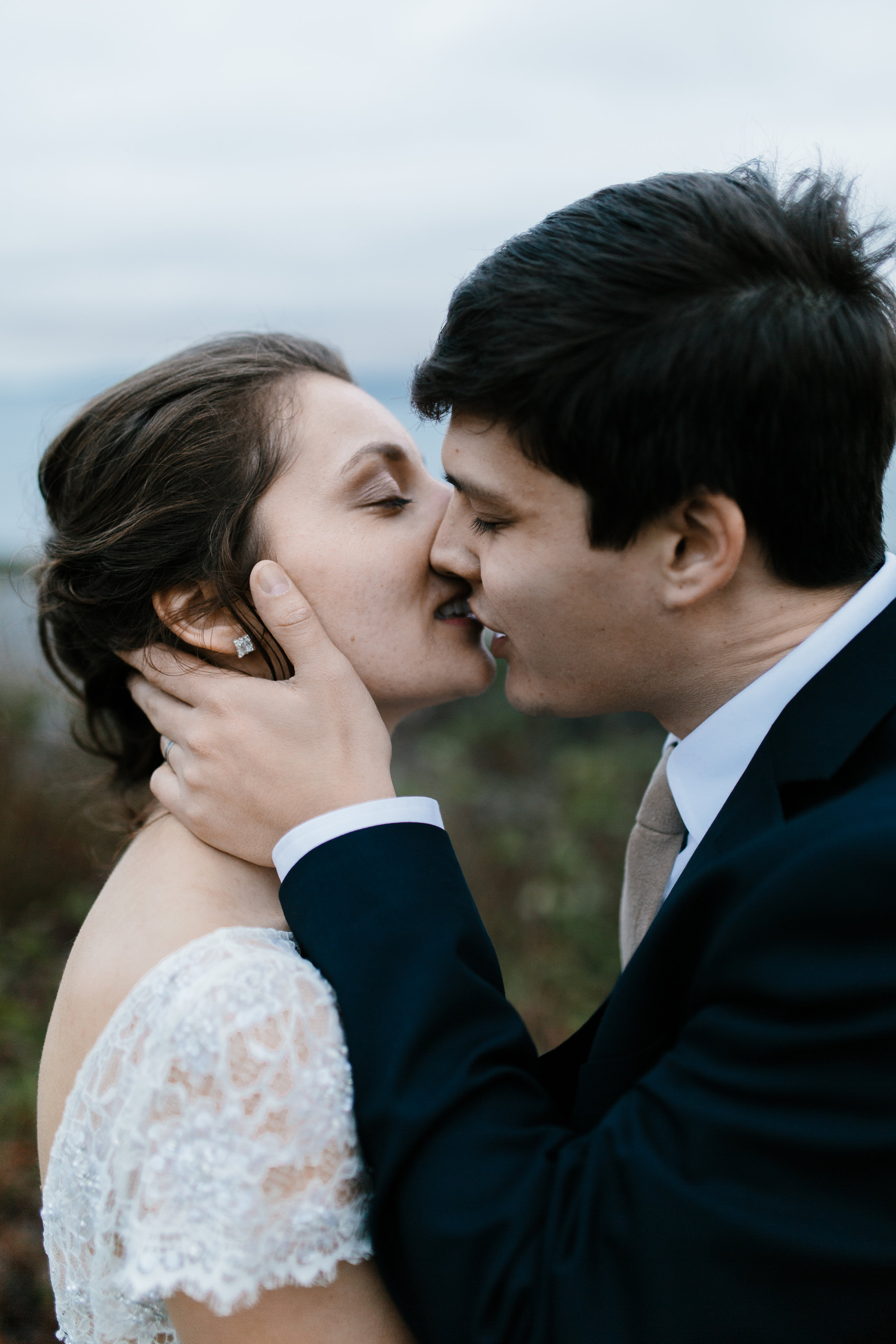 intimate bride and groom kiss 
