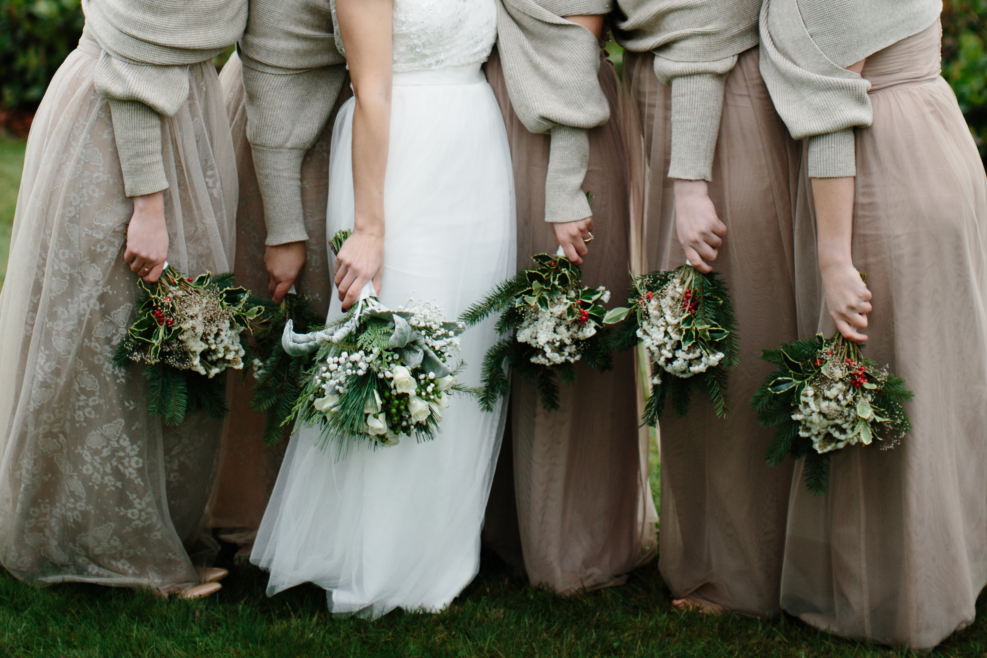 winter wedding bouquets and gold dresses