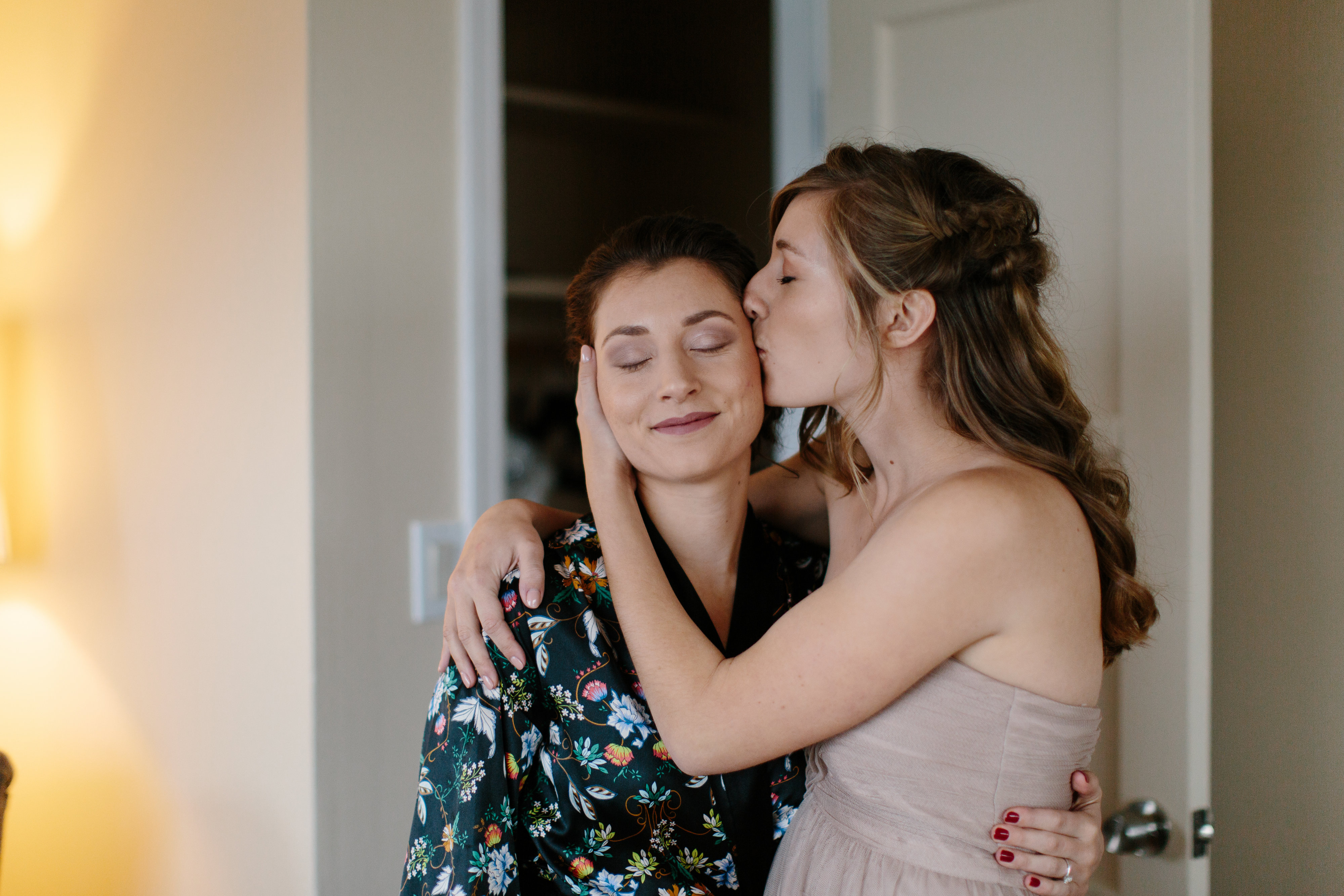 bride and maid of honor sister moment