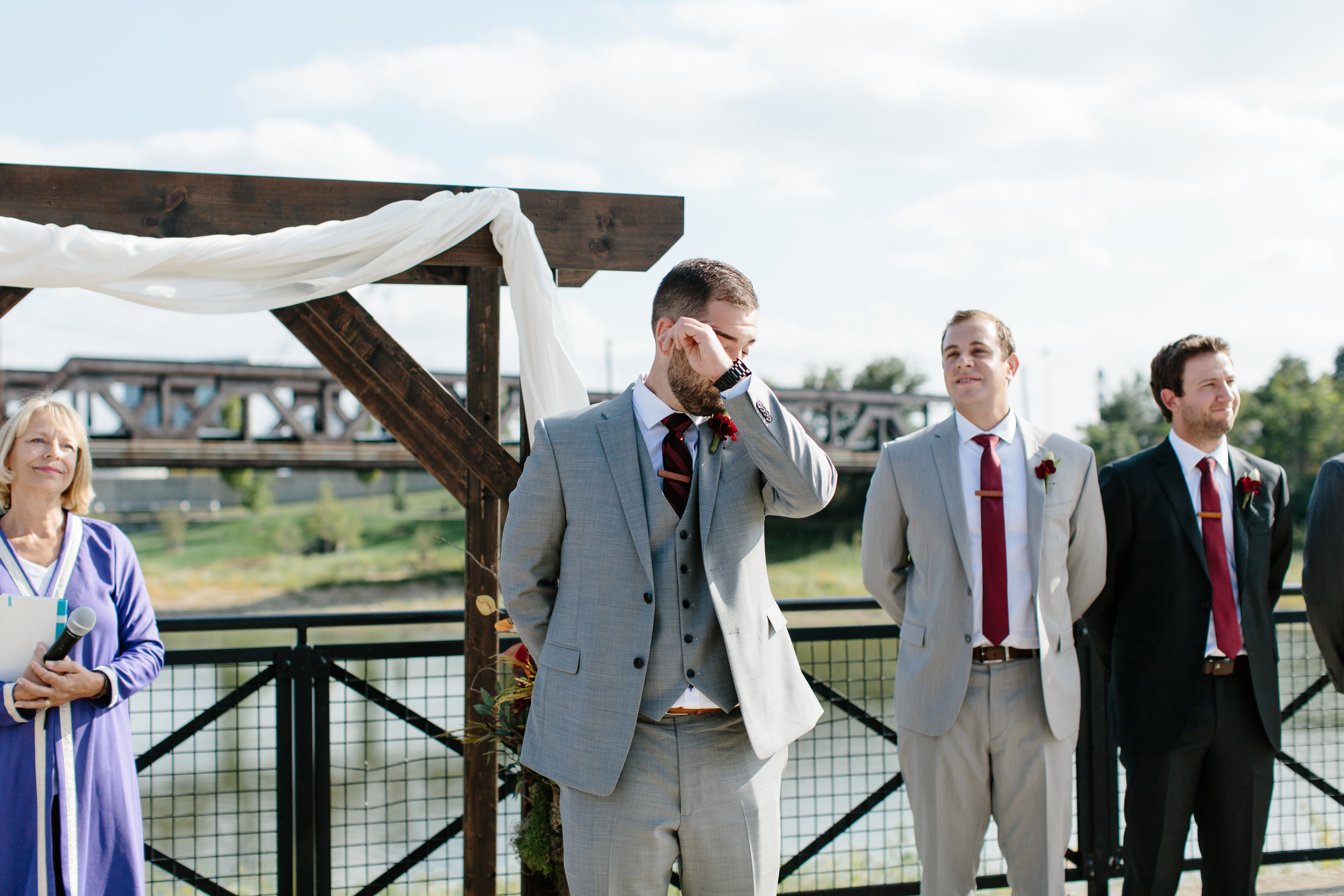 groom crying at first look