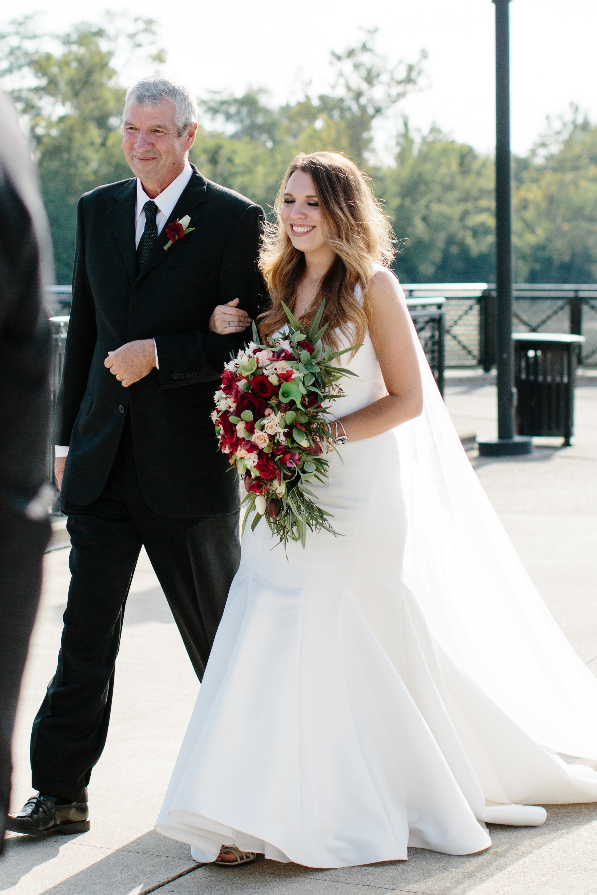 bride walking down the aisle with father