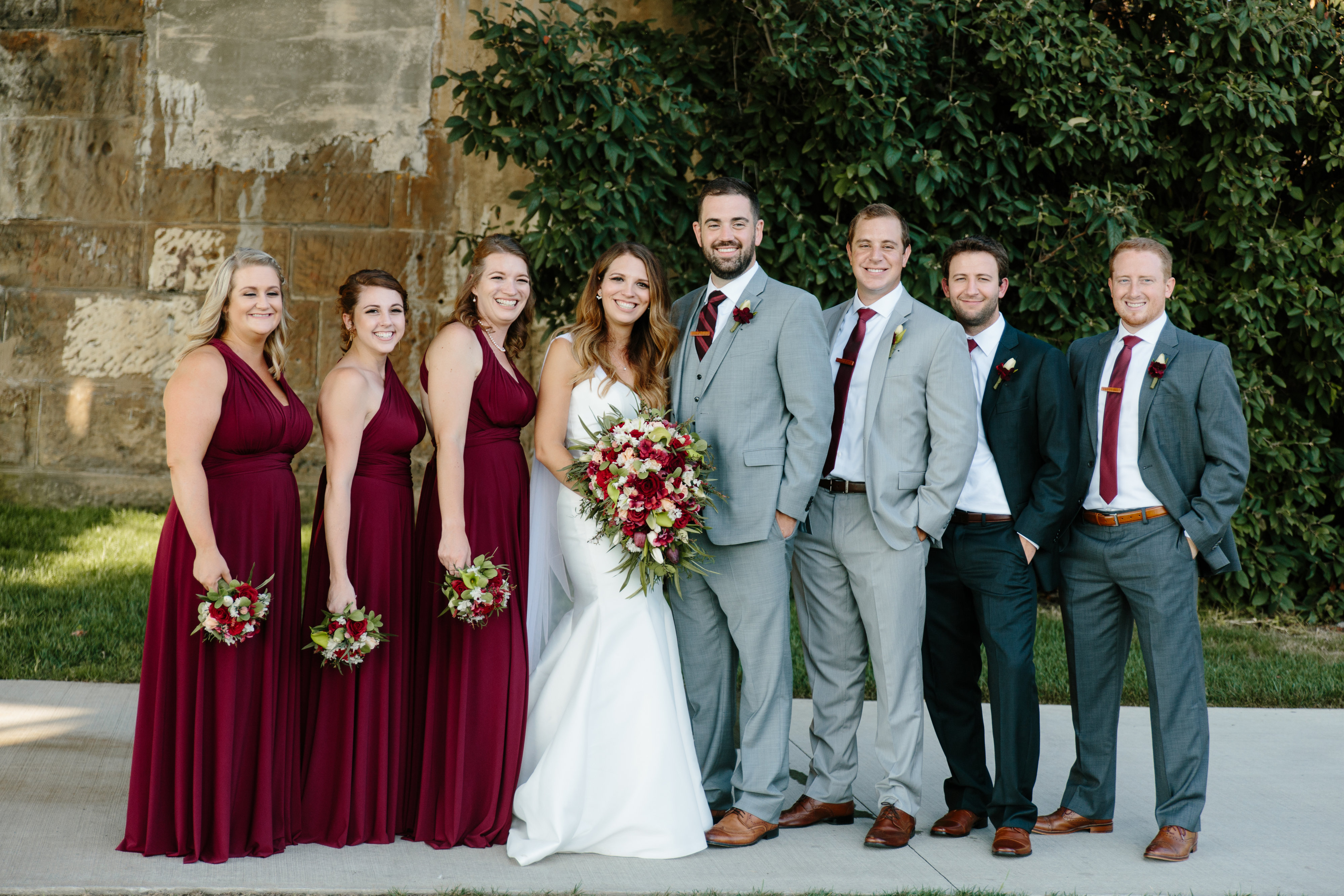bridal party in maroon and gray