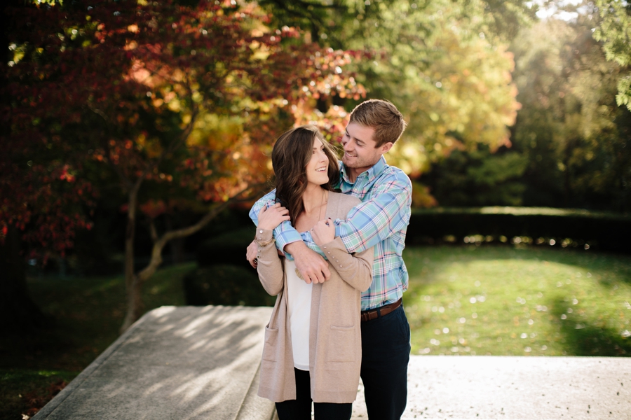 couple looking at each other during fall engagement 