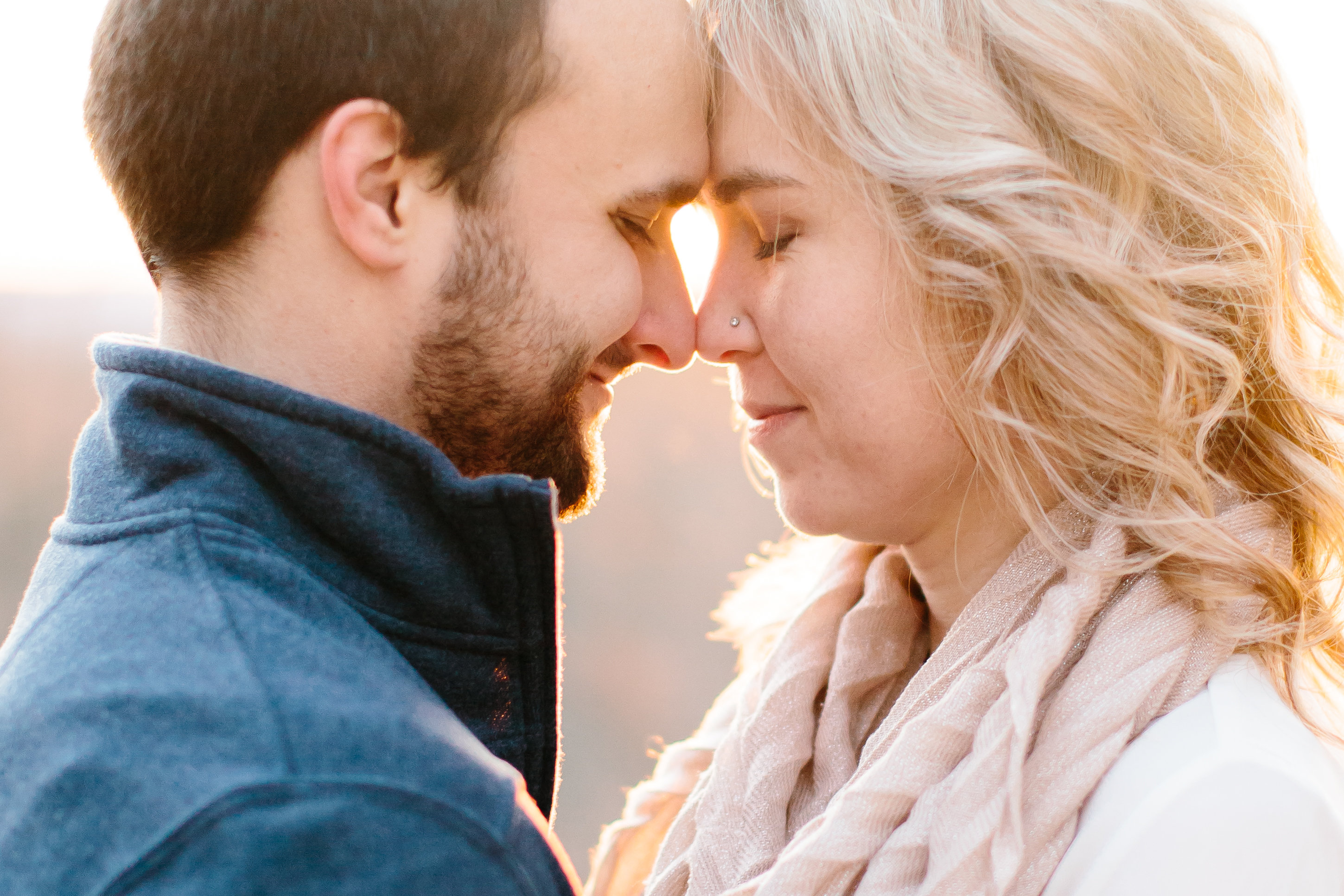couple forehead to forehead during engagement session