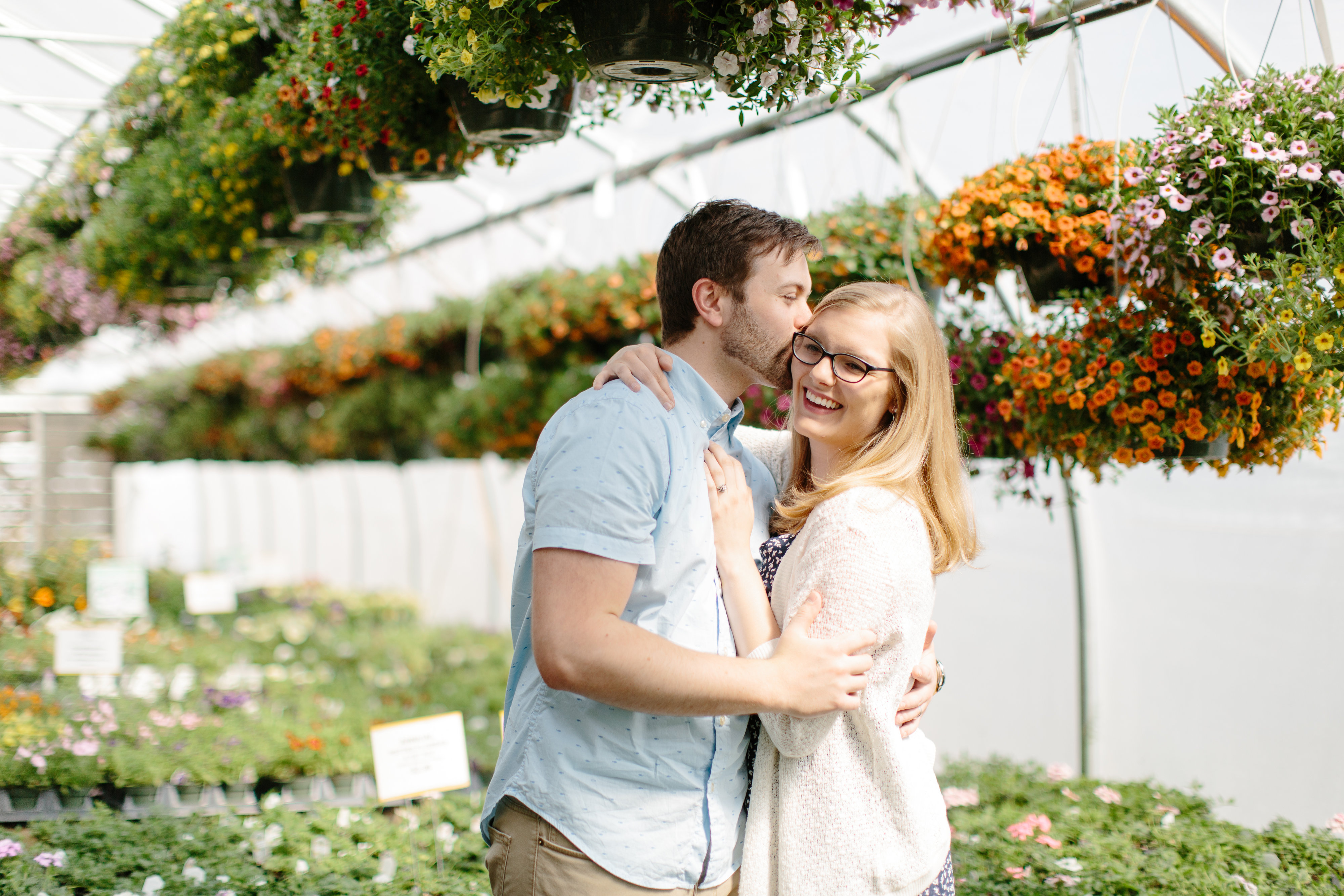 couple spring session in greenhouse