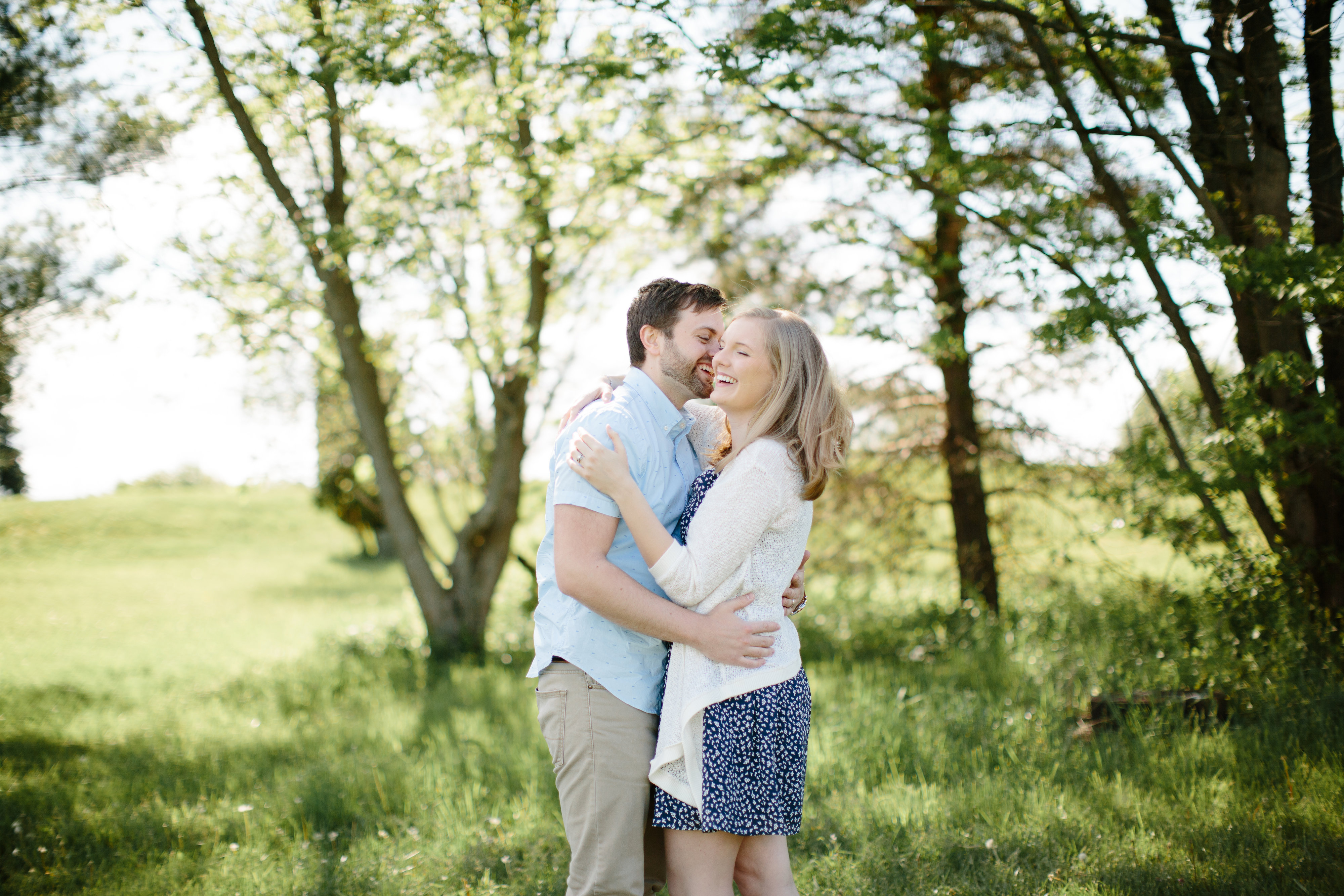 couple laughing together during engagement session
