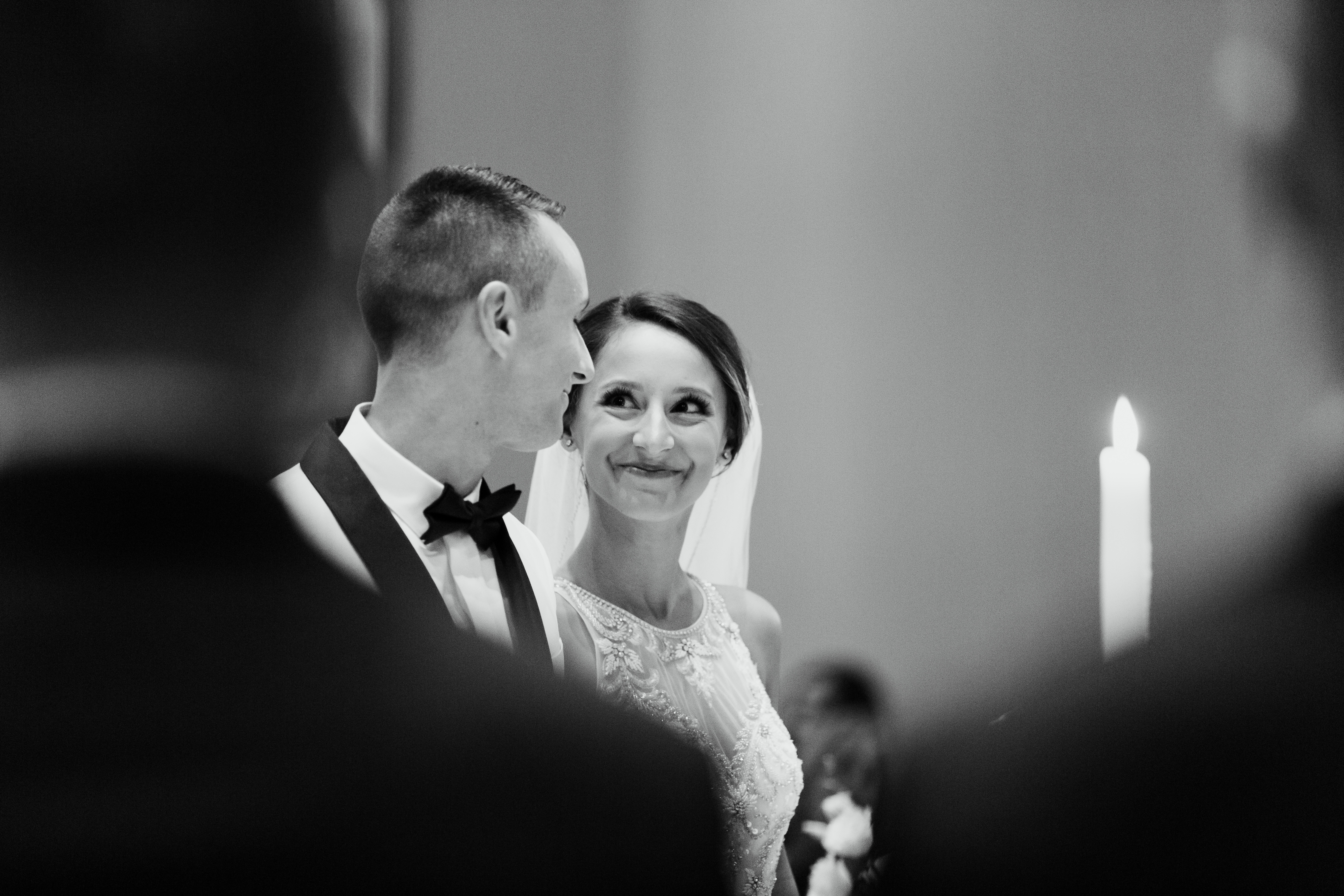 Bride looks at groom during wedding ceremony