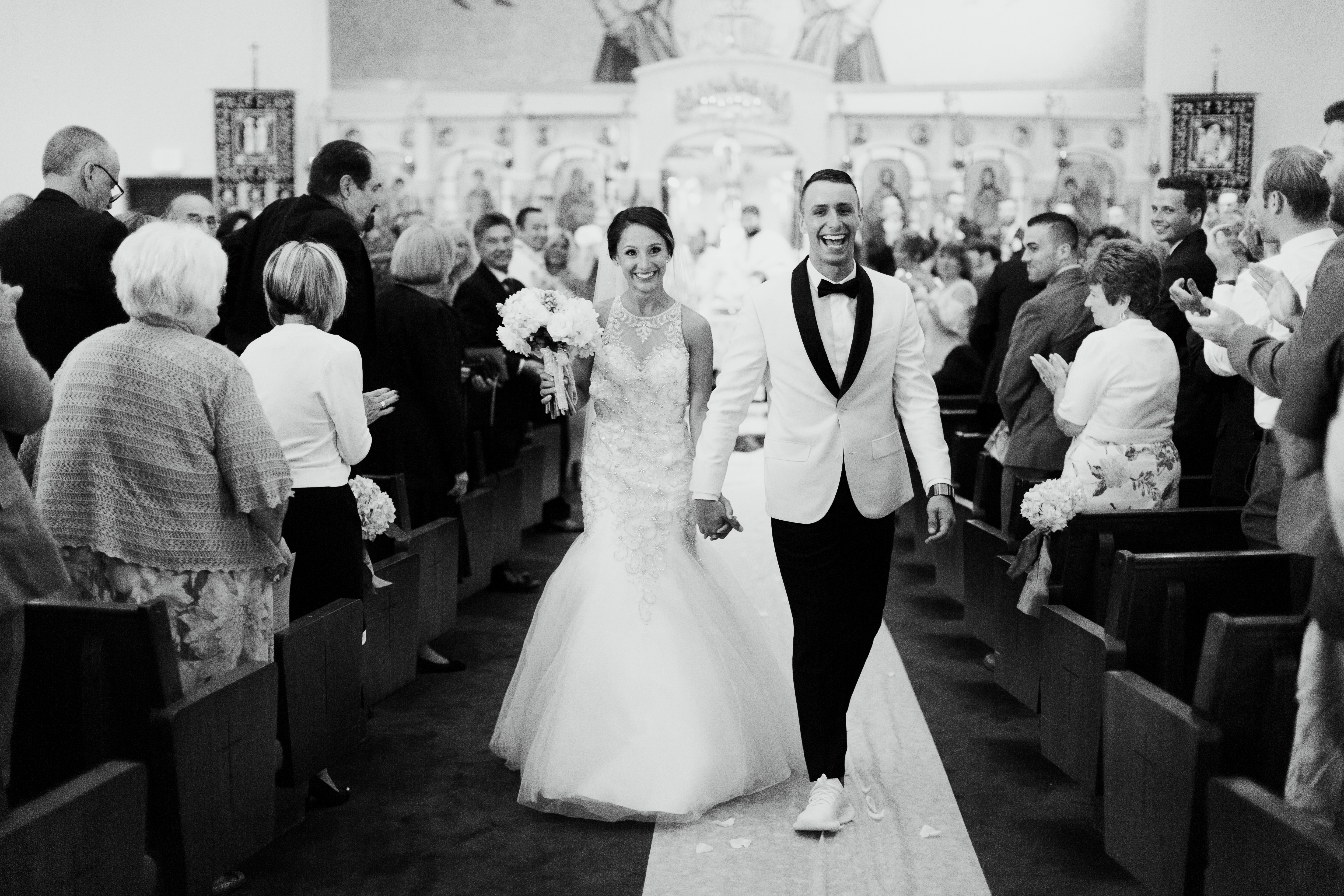 Couple excitedly walk down aisle