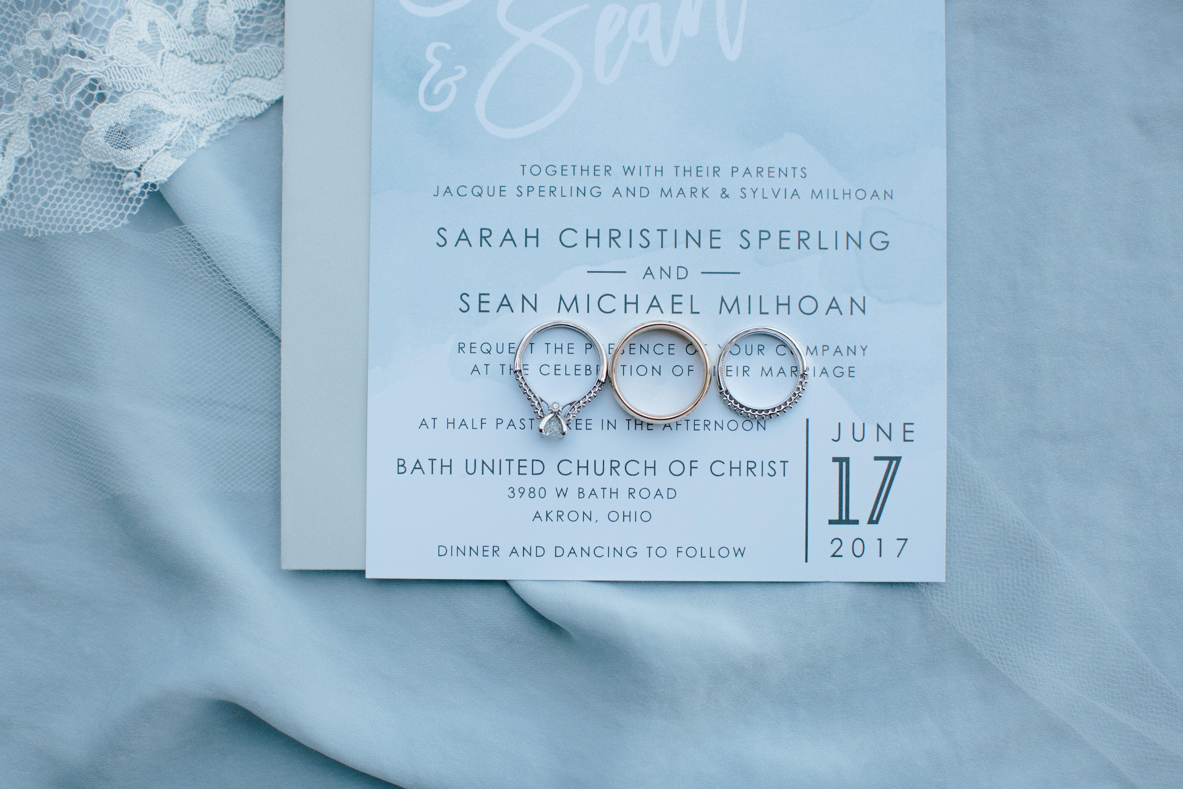 blue artsy wedding invitation and rings