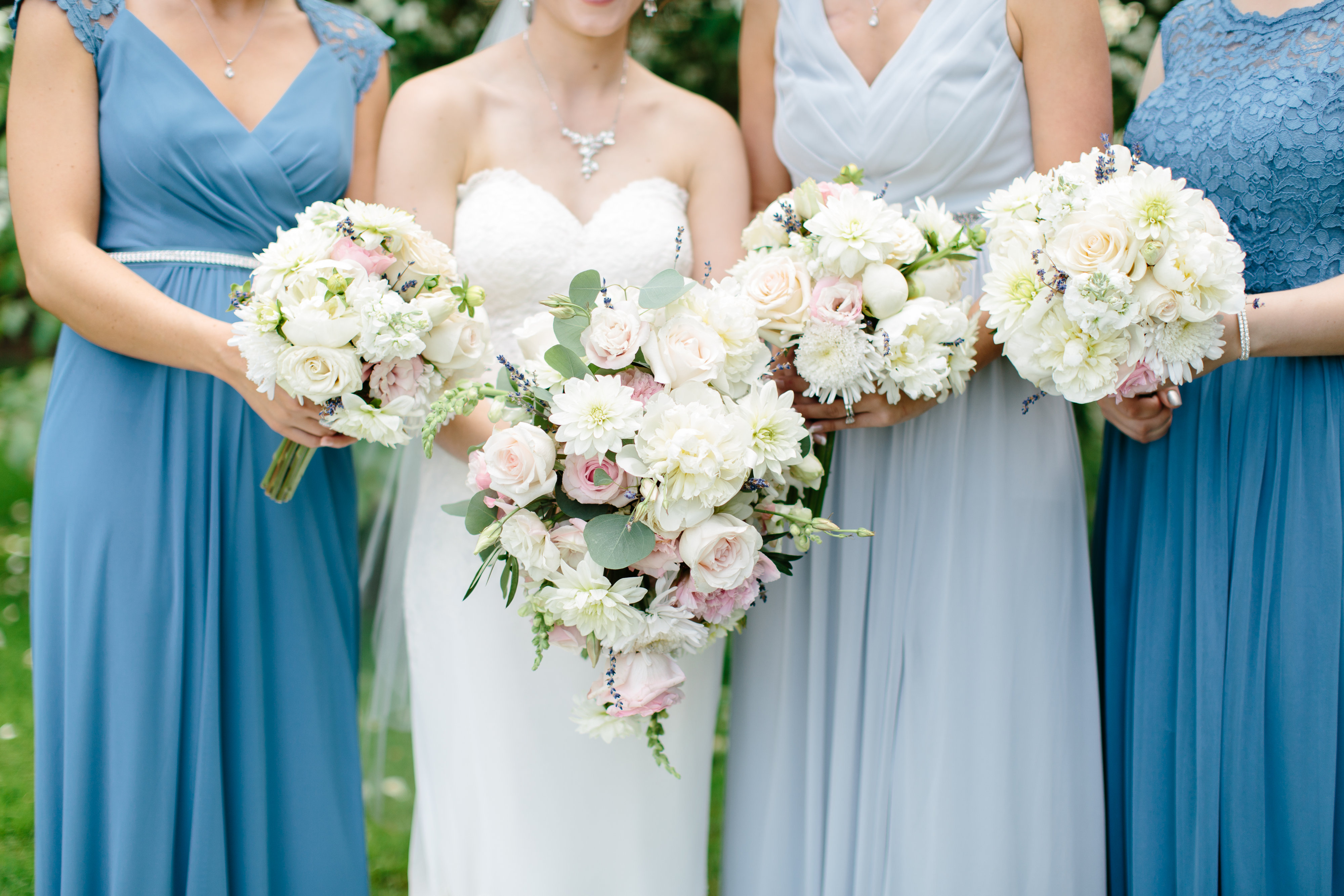 dusty blue bridesmaids and pink and white bouquets
