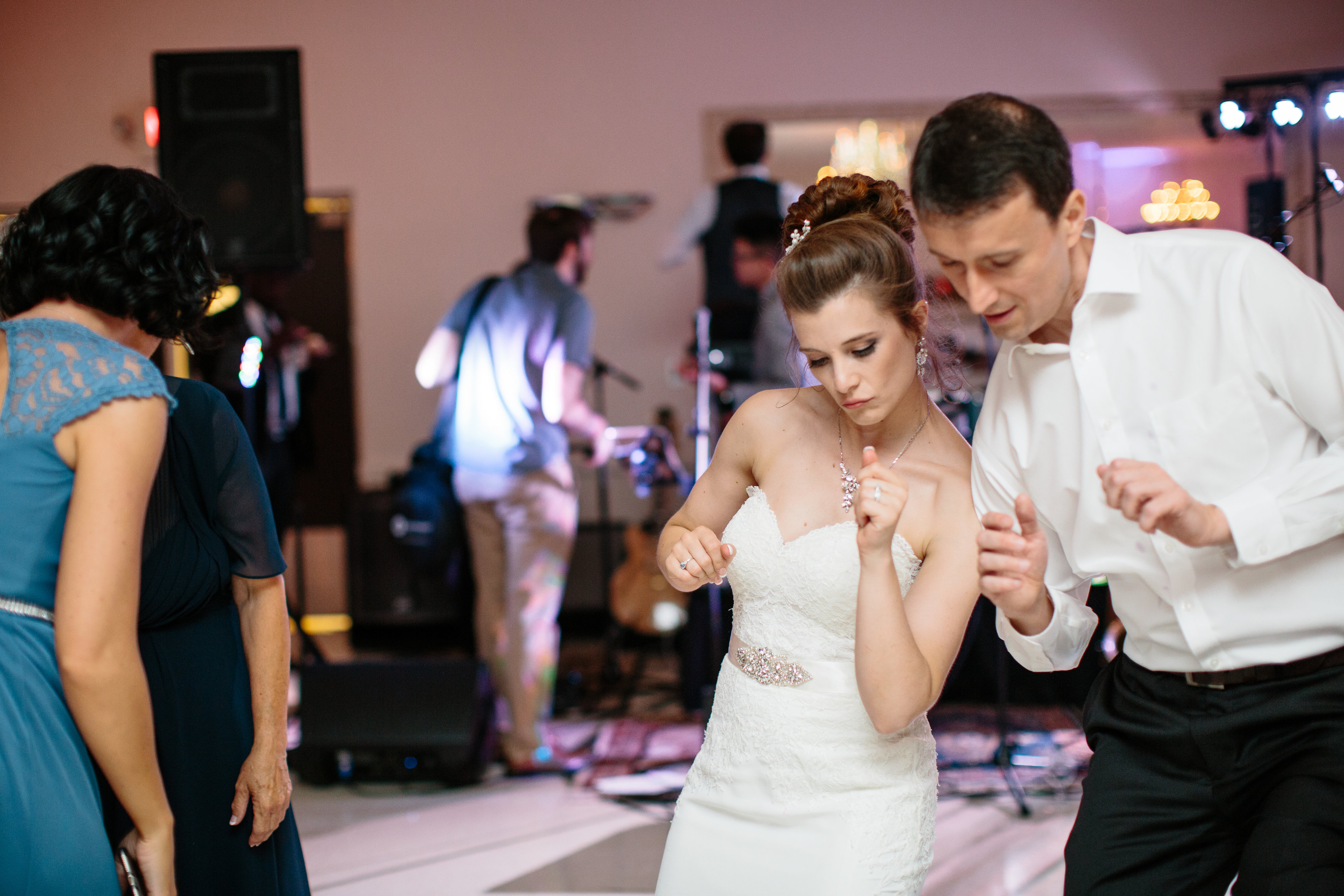 bride dancing to live wedding band at reception