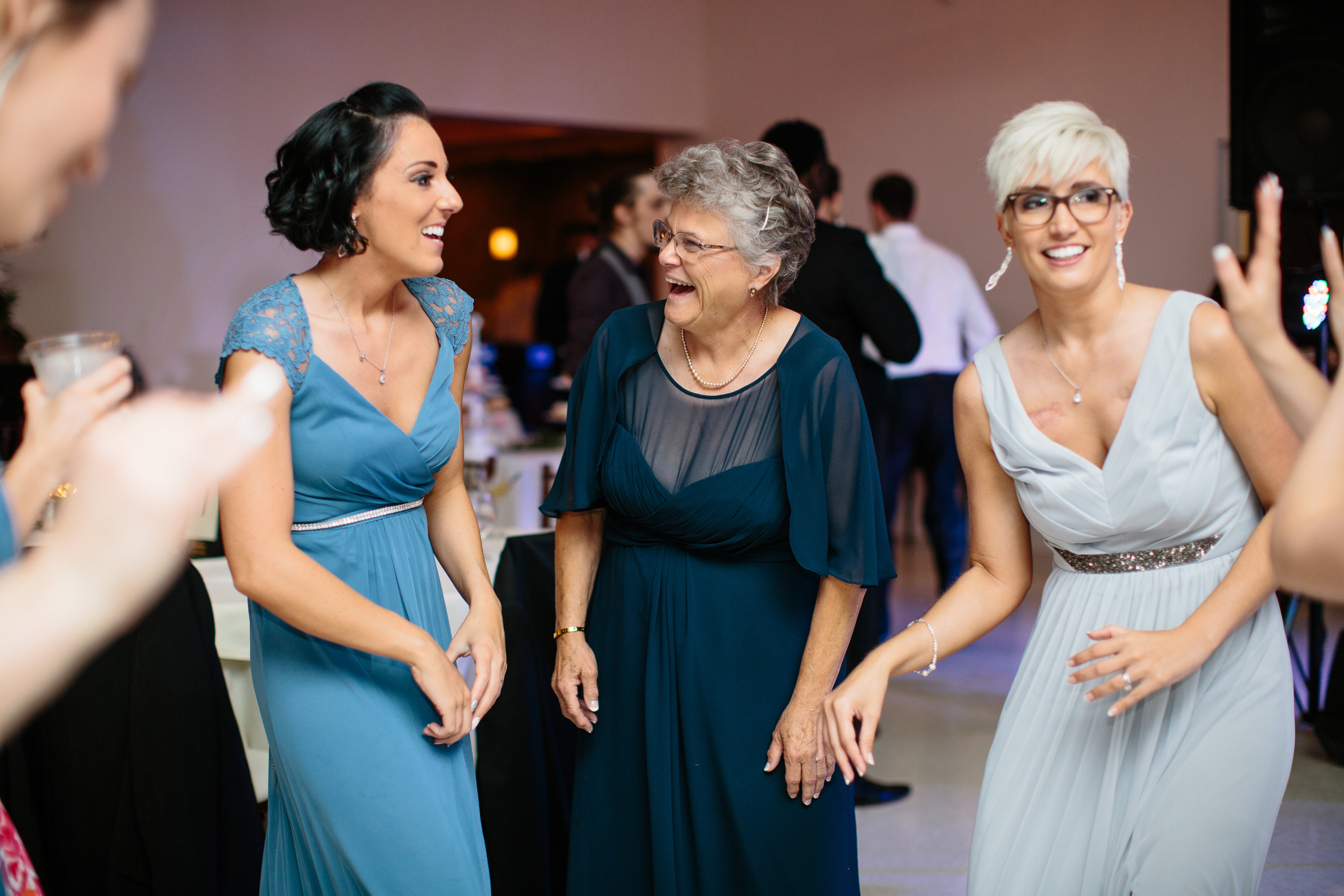 mother of the bride dancing with bridesmaids