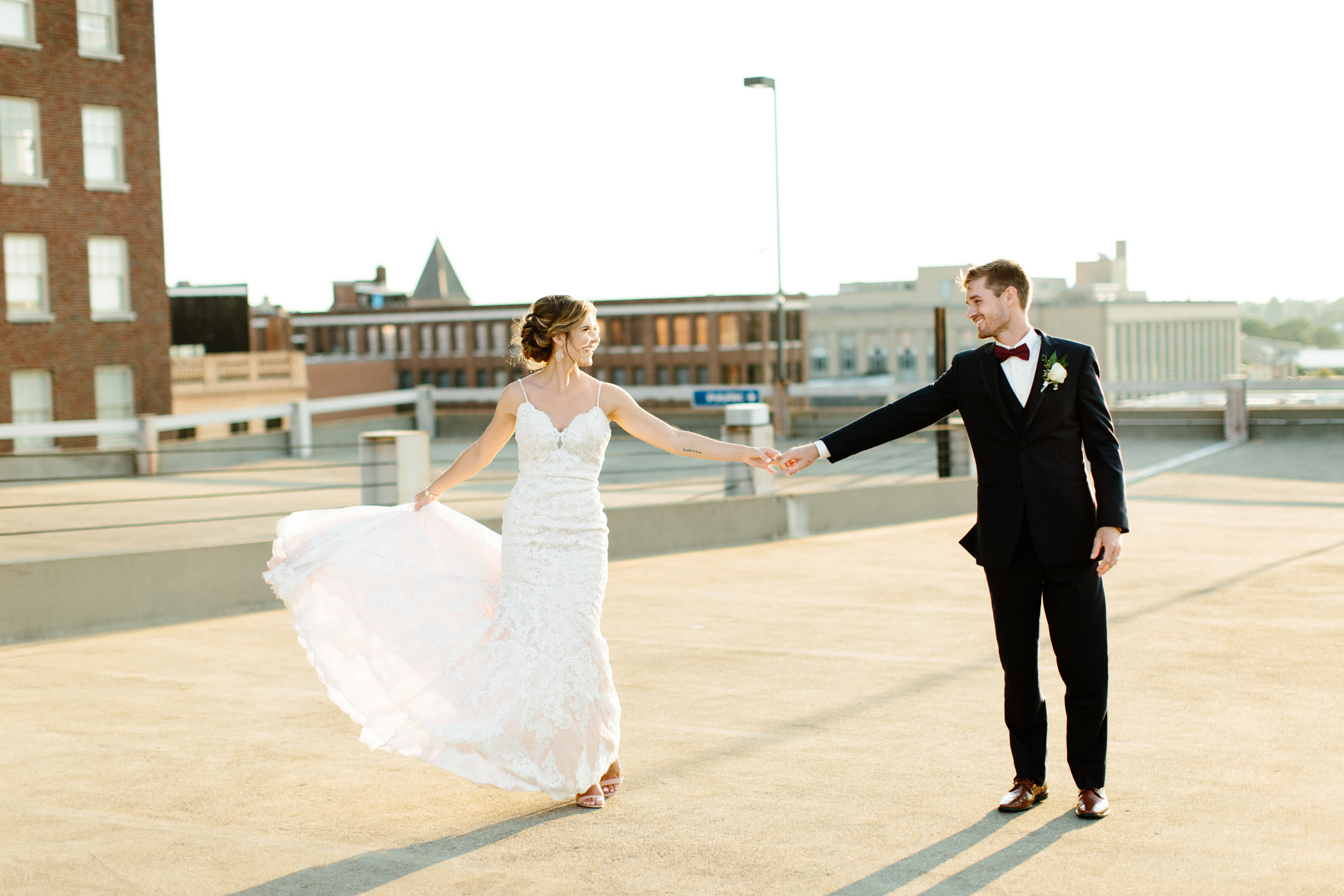 bride and groom portraits on parking deck in Cleveland