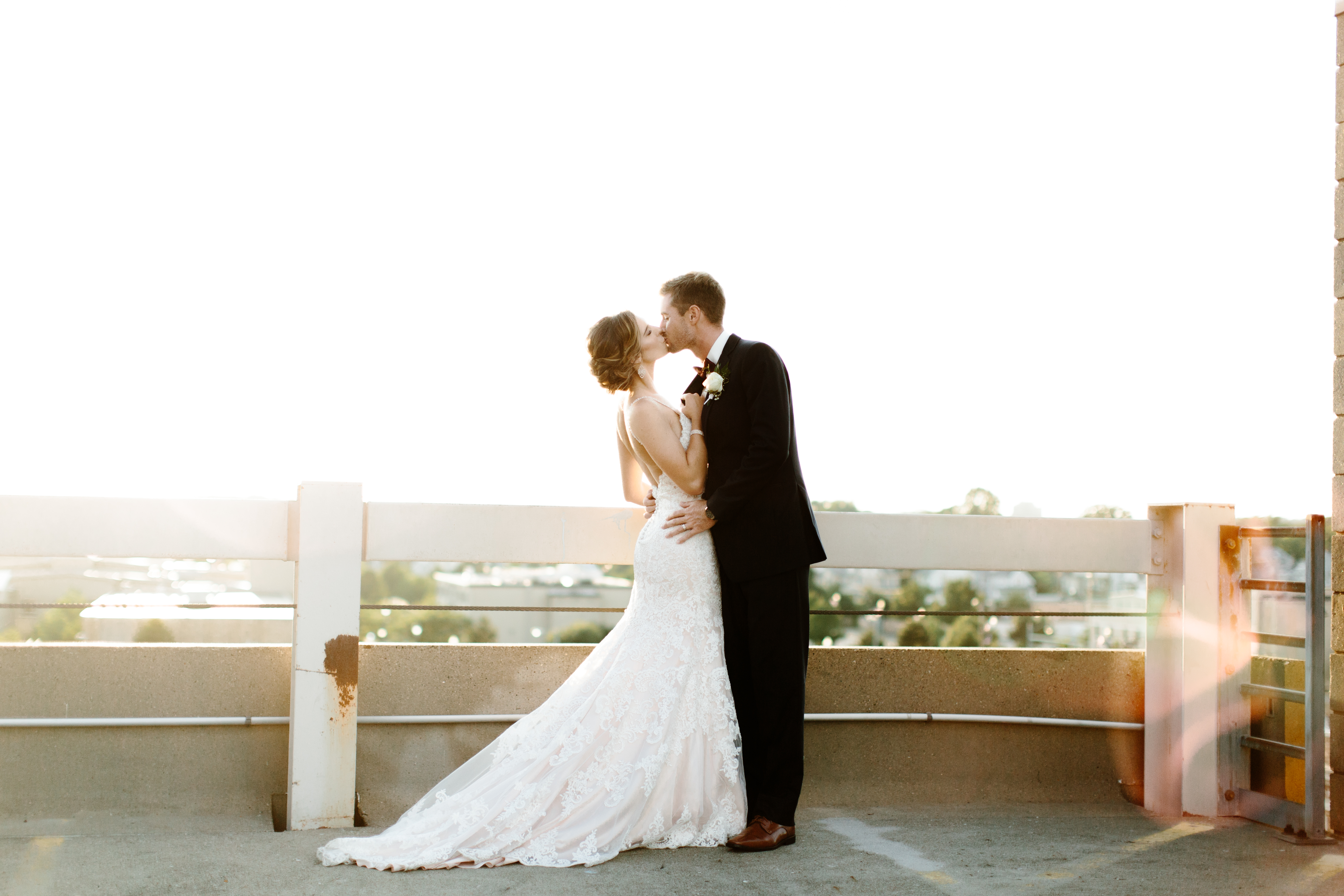 bride and groom on city rooftop in cleveland