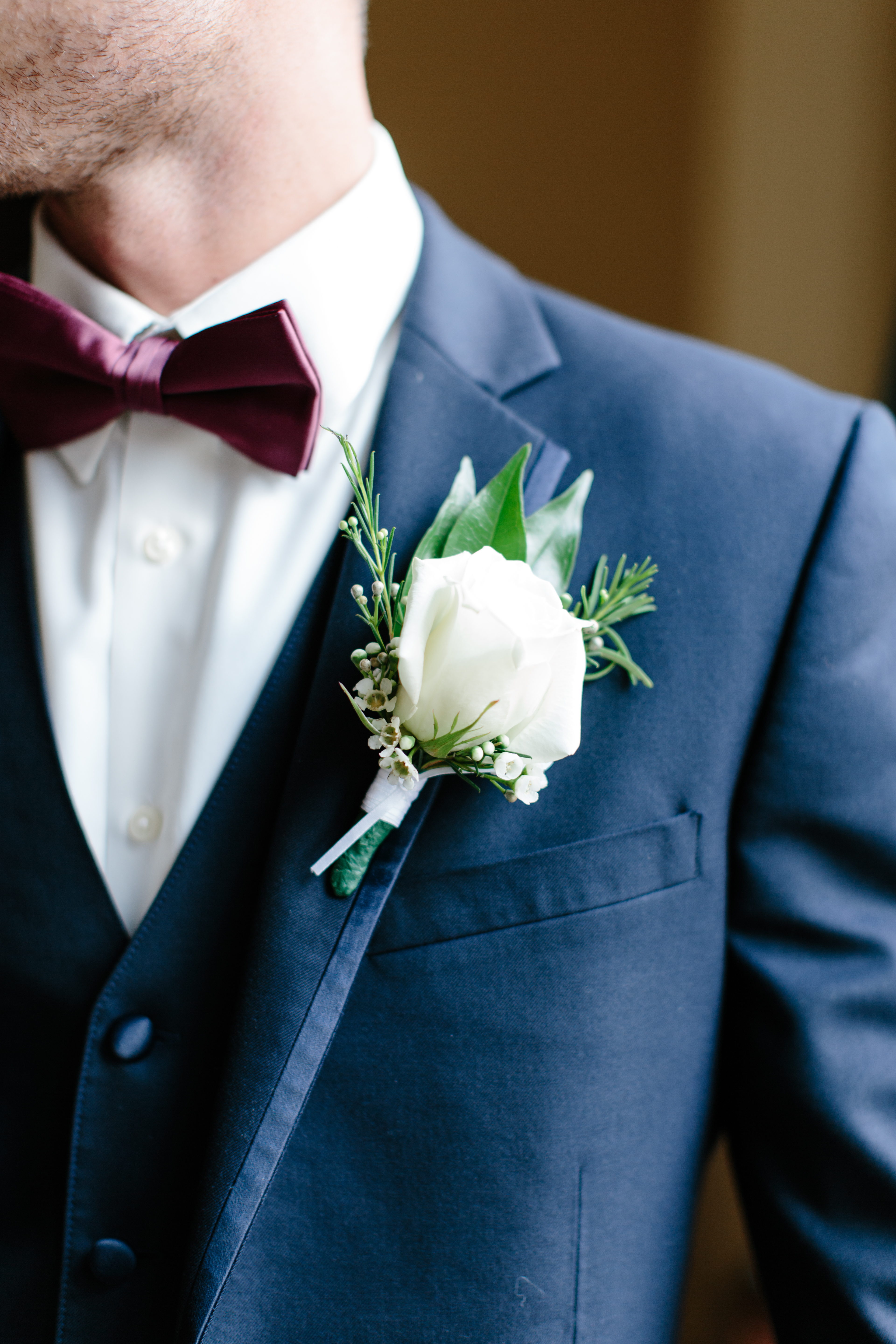 maroon and navy groom details