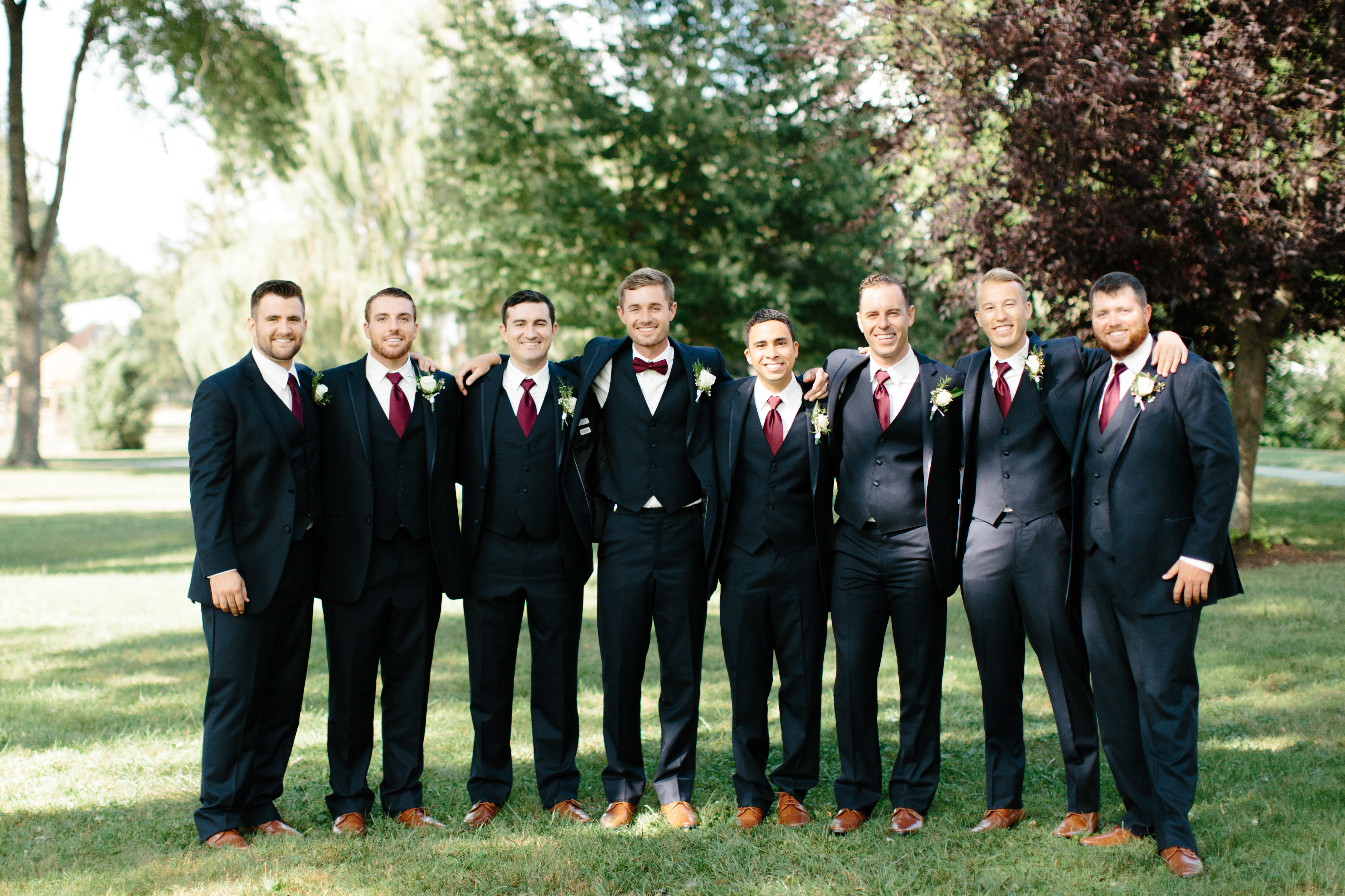 groomsmen with groom during wedding portraits