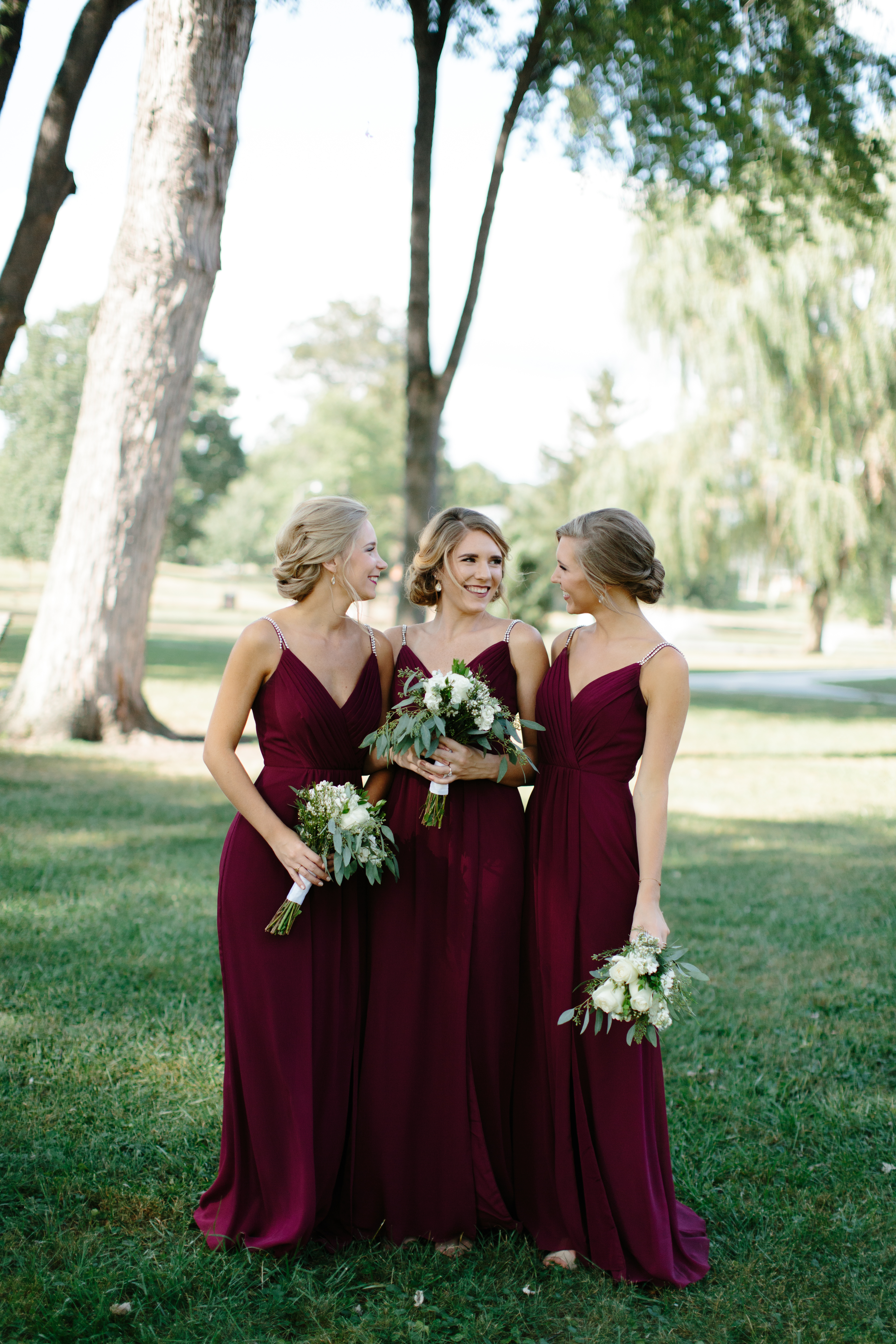 bridesmaids in maroon dresses from David's bridal