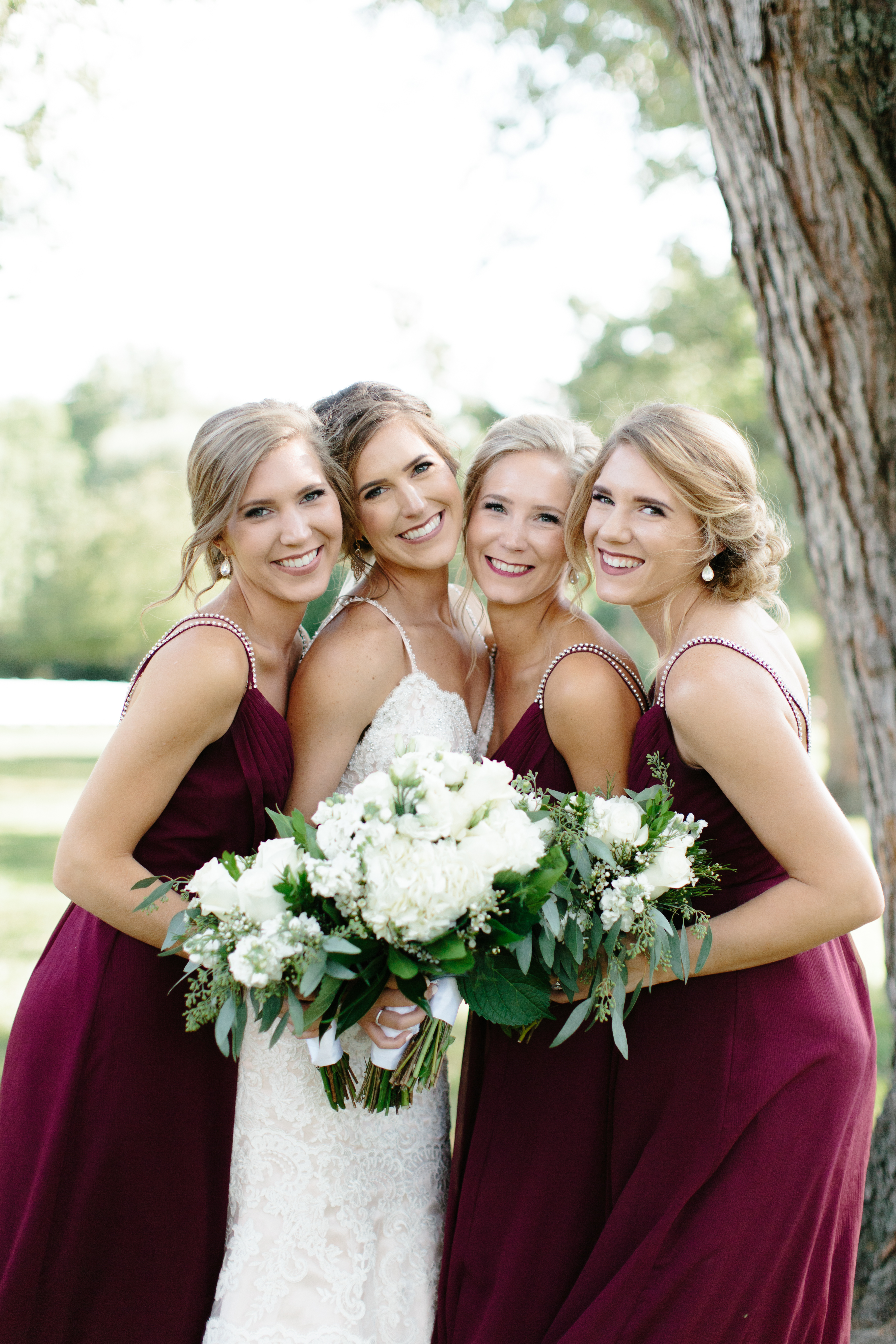 bride and sisters on wedding day