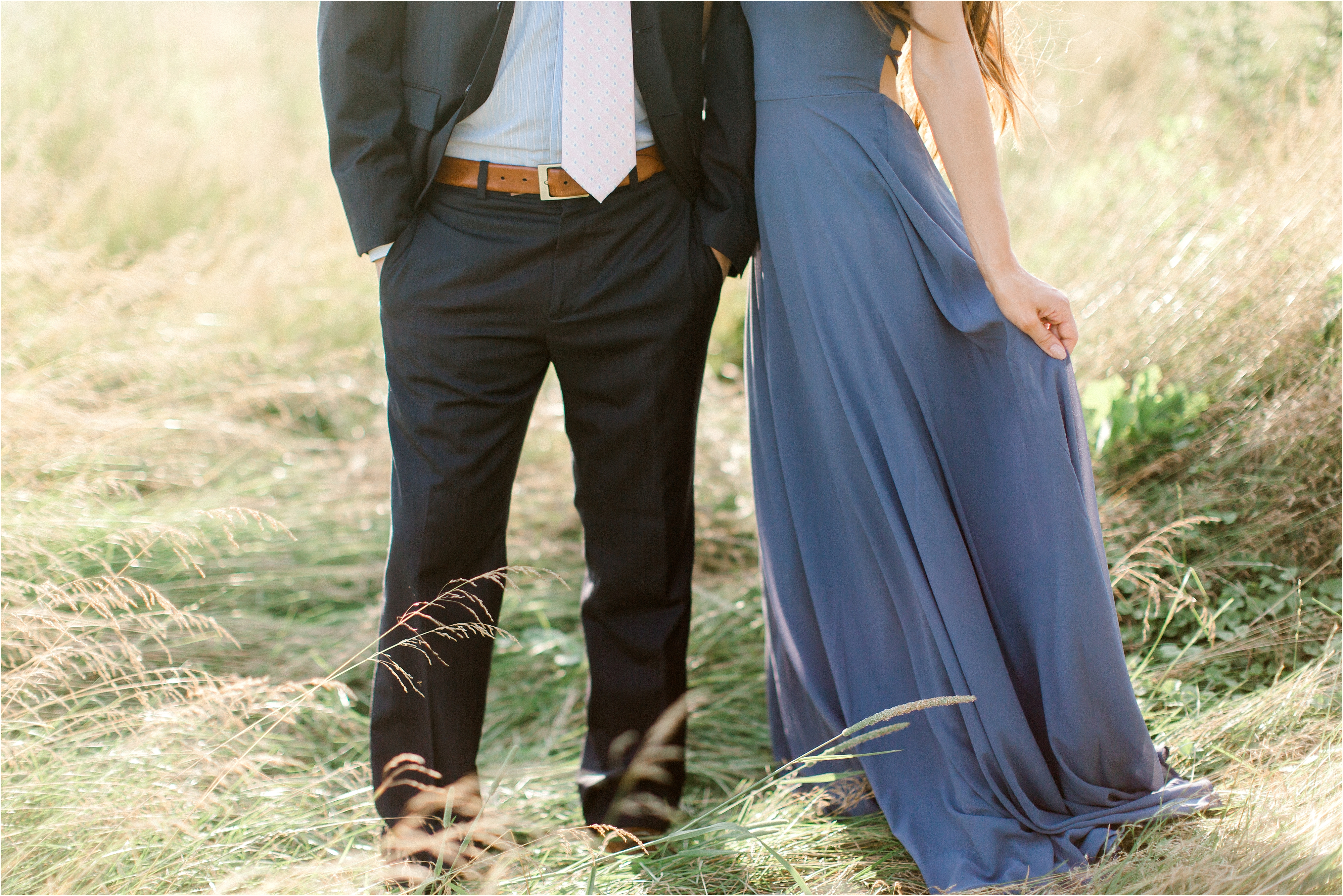 Long blue dress engagement session in field 