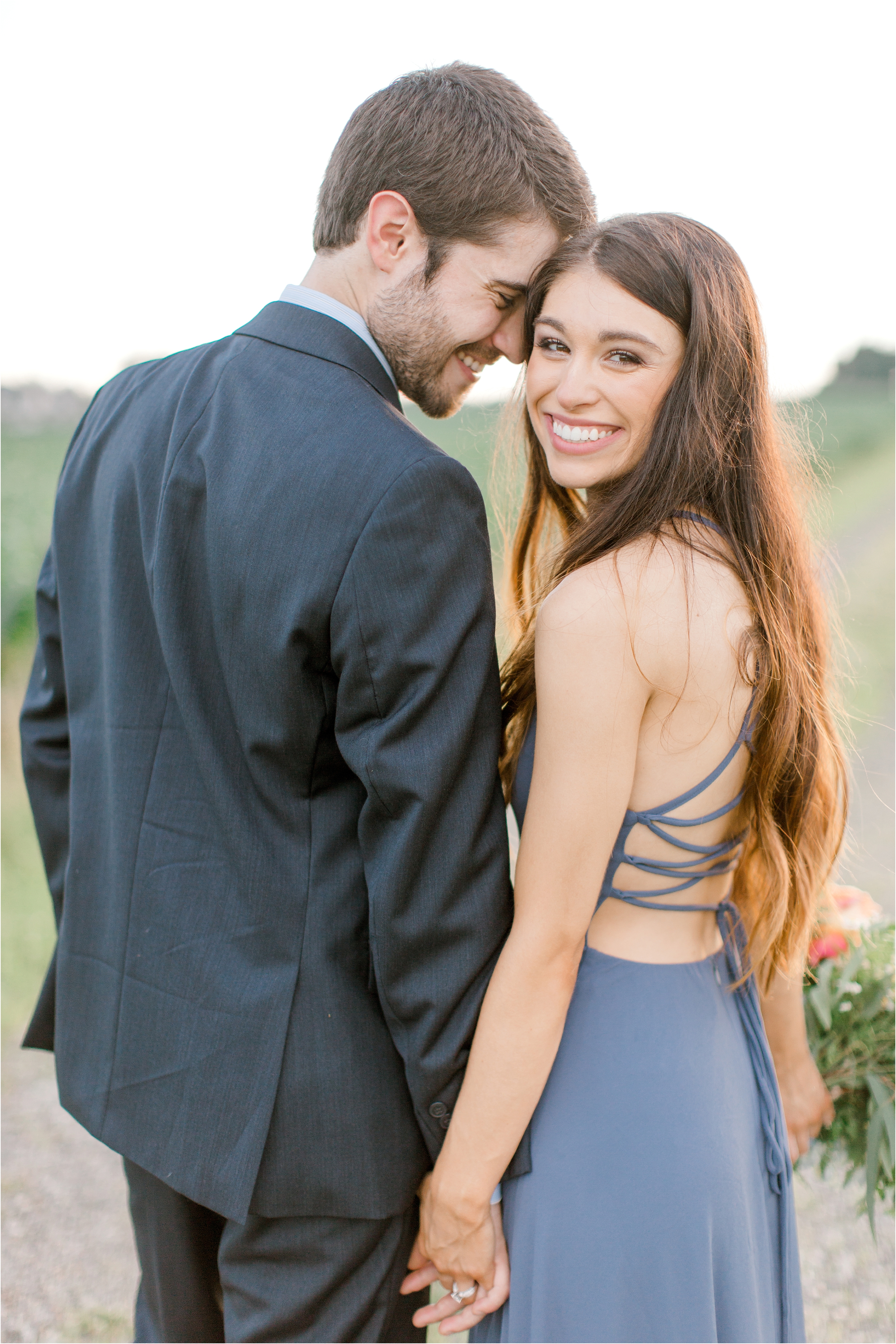 romantic blue dress at whimsical field engagement session