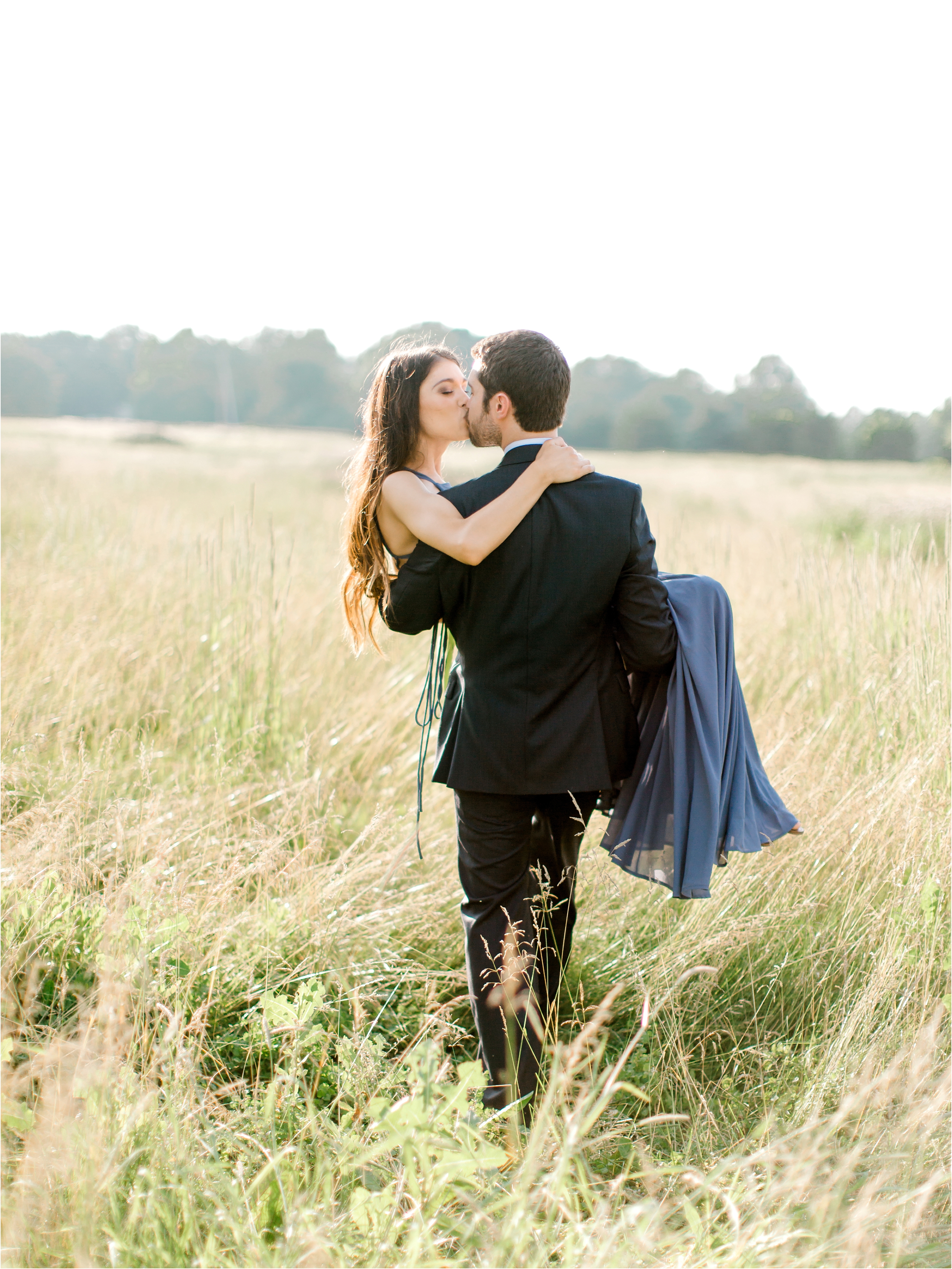 couple in field during cleveland engagement session 