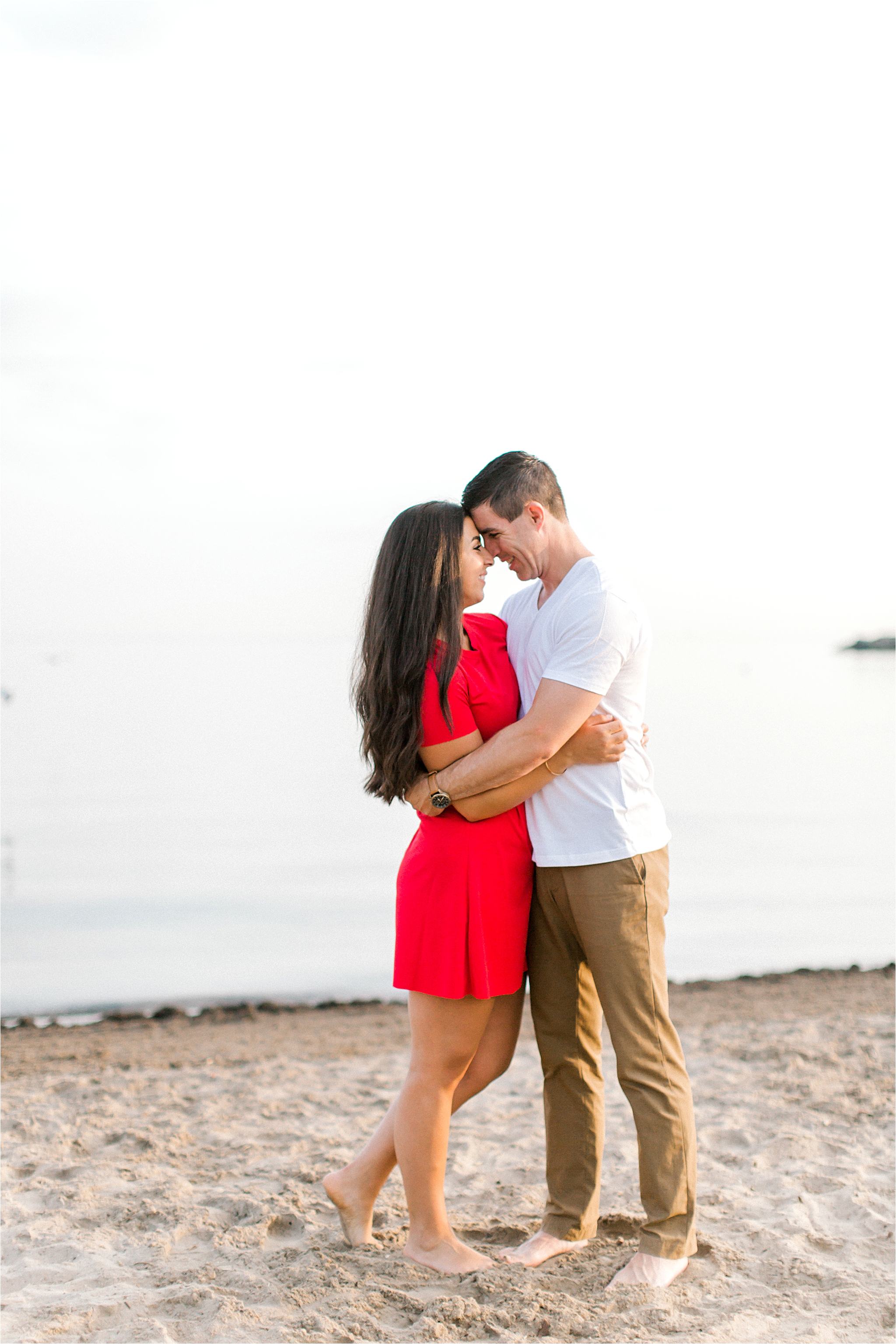 red dress beach engagement in cleveland ohio