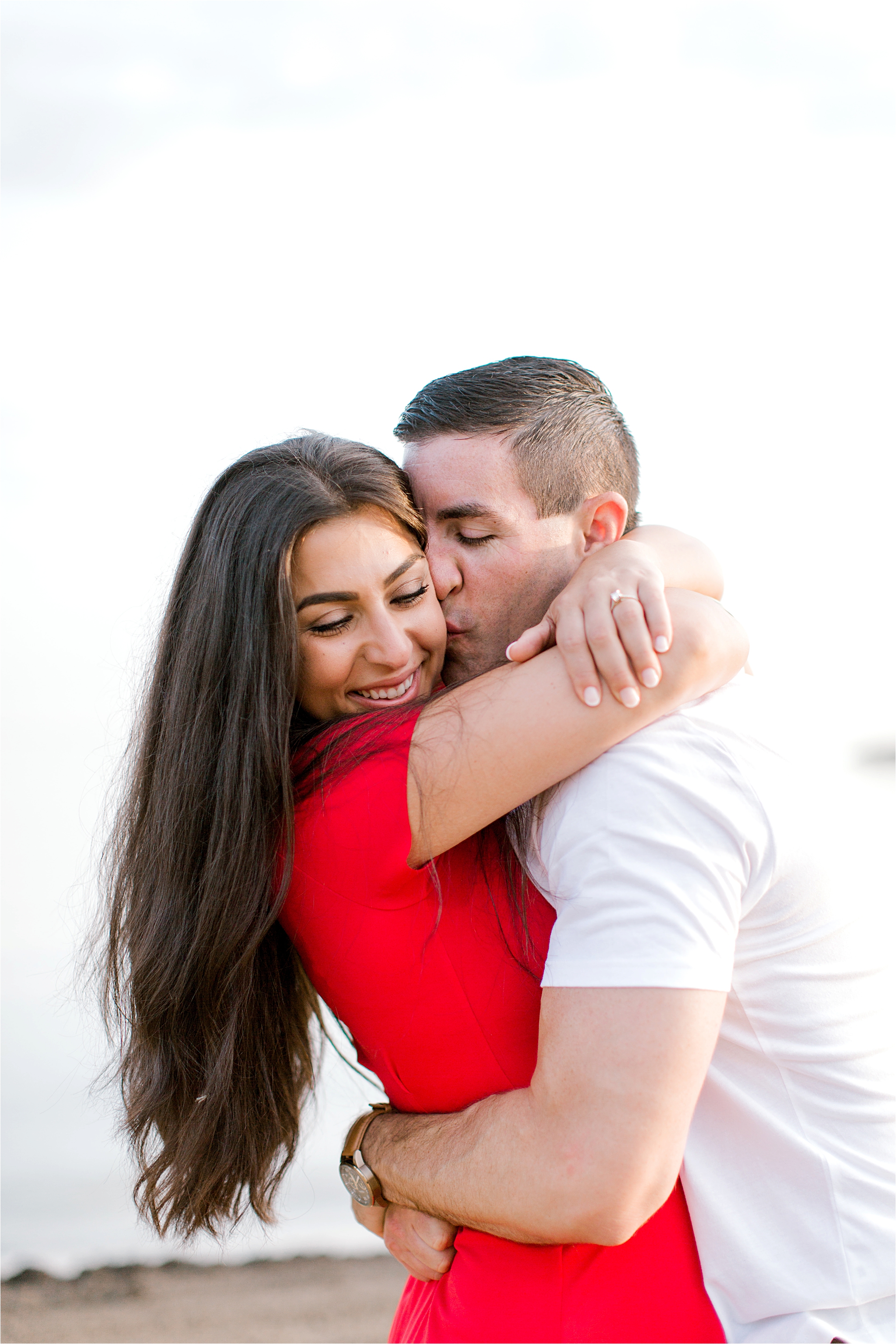 beach engagement session red dress
