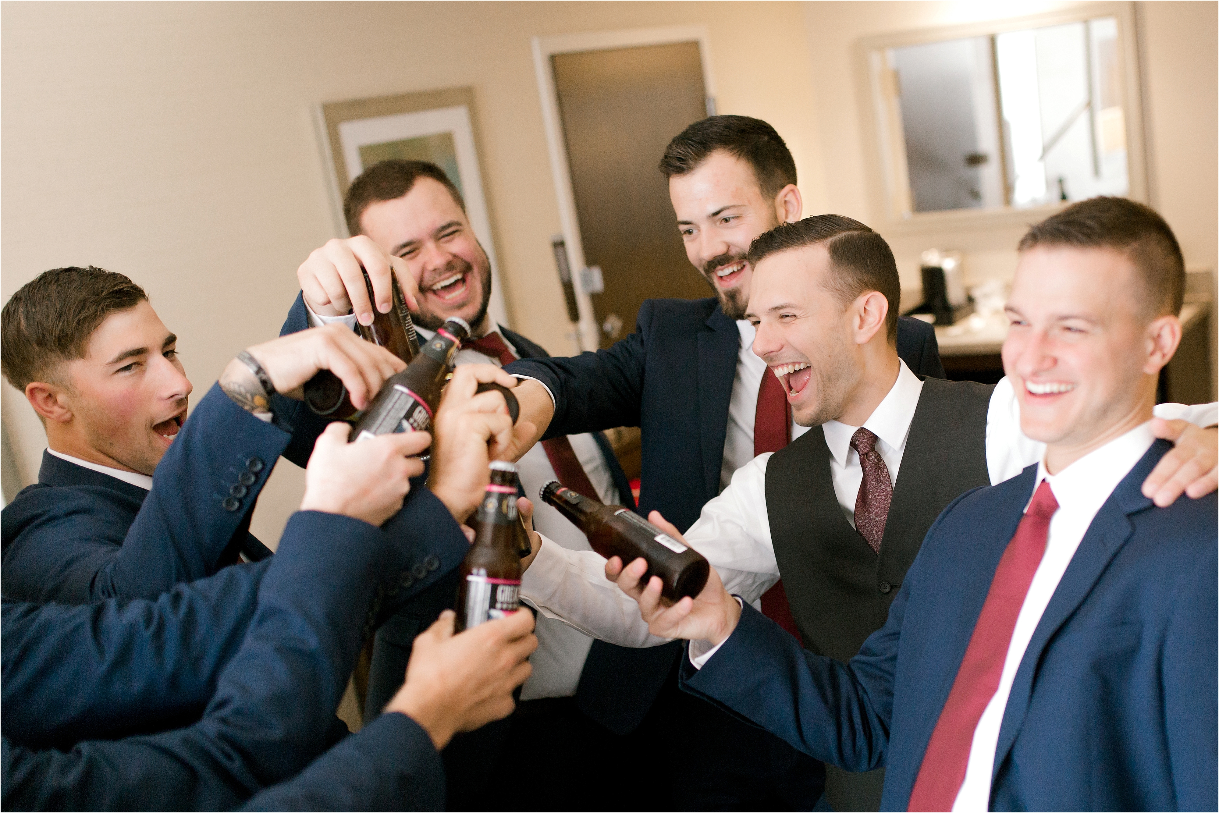groom and groomsmen toasting at cleveland wedding