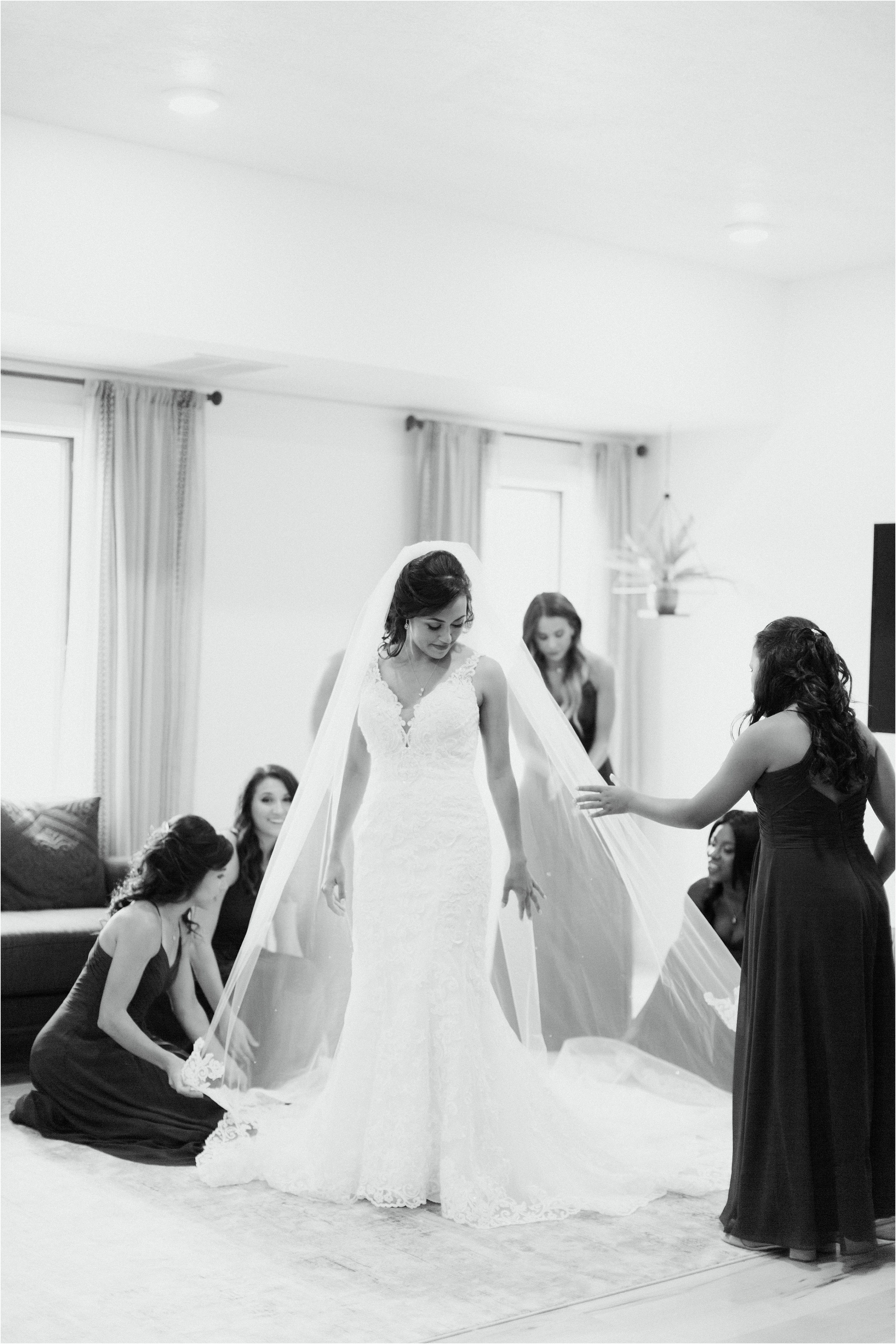bridesmaids fixing bride's veil before ceremony at ariel pearl center