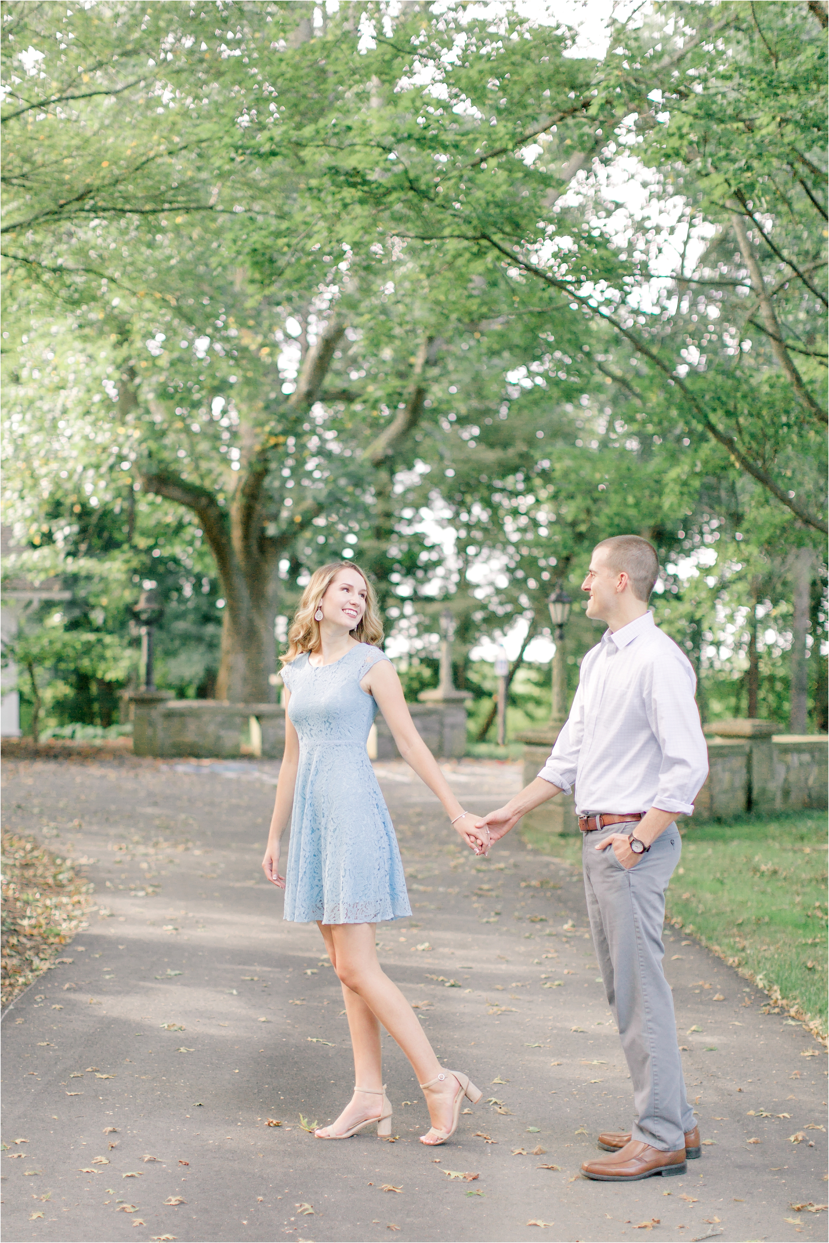 Engagement session holding hands in Cleveland metro park