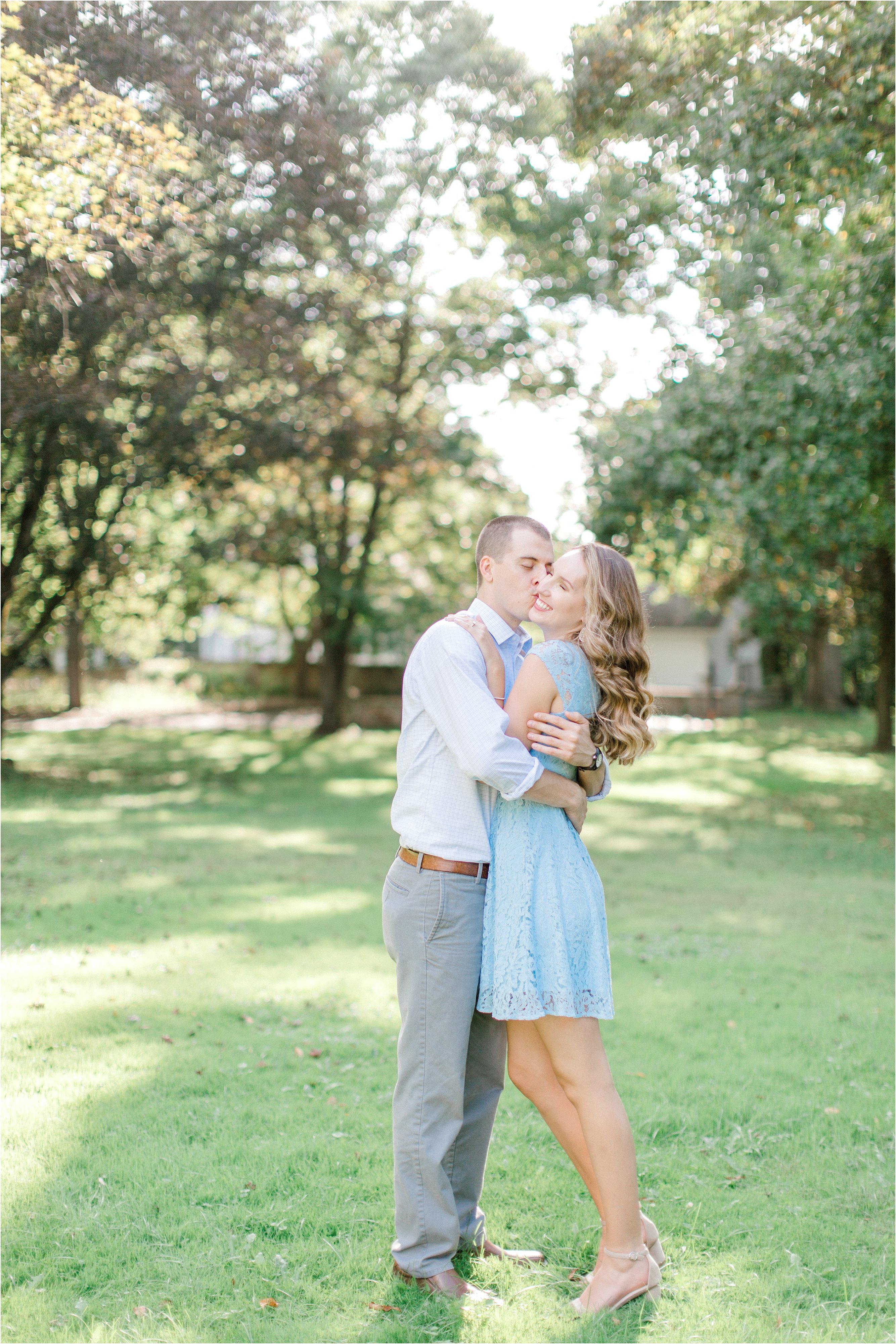 couple snuggling during columbus engagement session