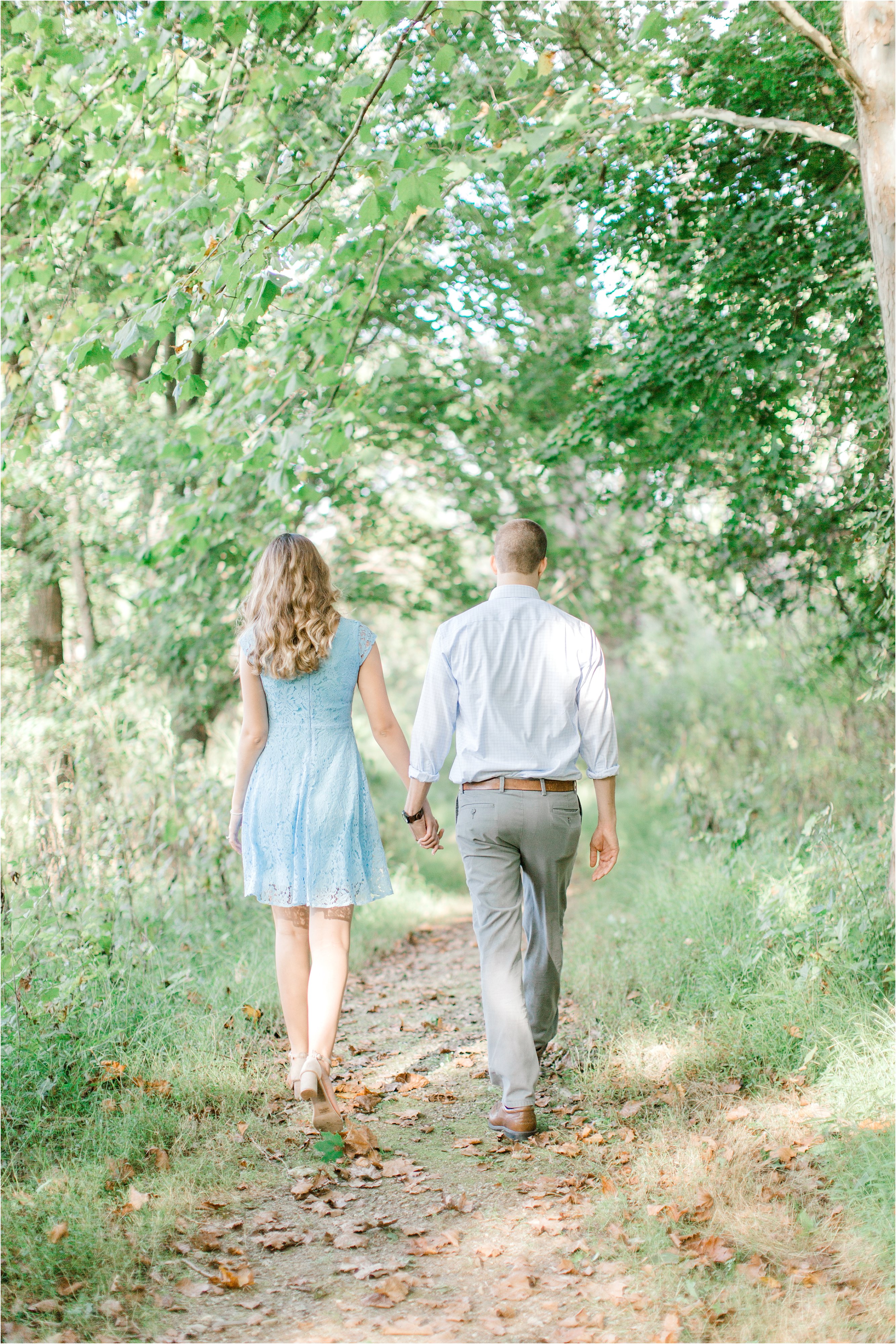 romantic walk through cleveland metro park during engagement session