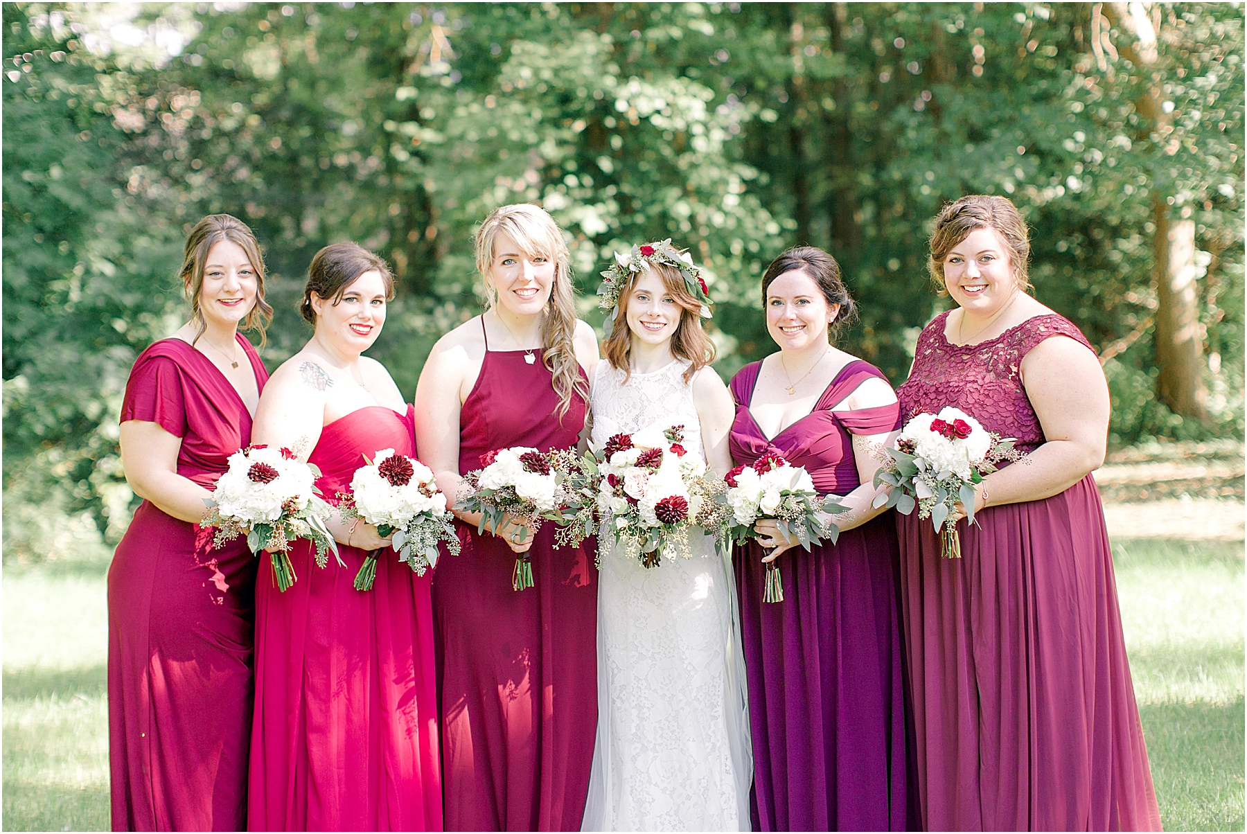 bridesmaids in shades of red and wine