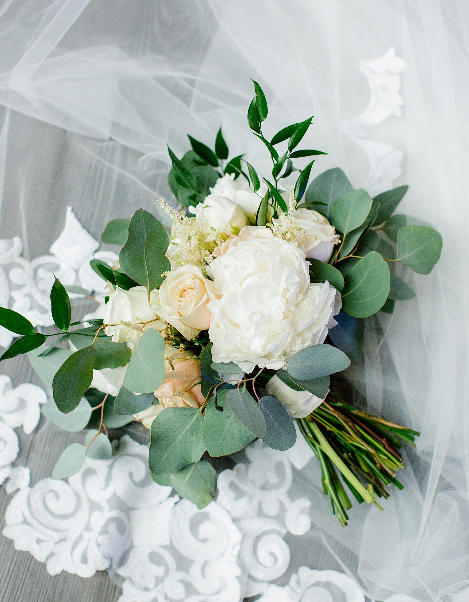 Peach, blush, and white flowers with eucalyptus wedding bouquet