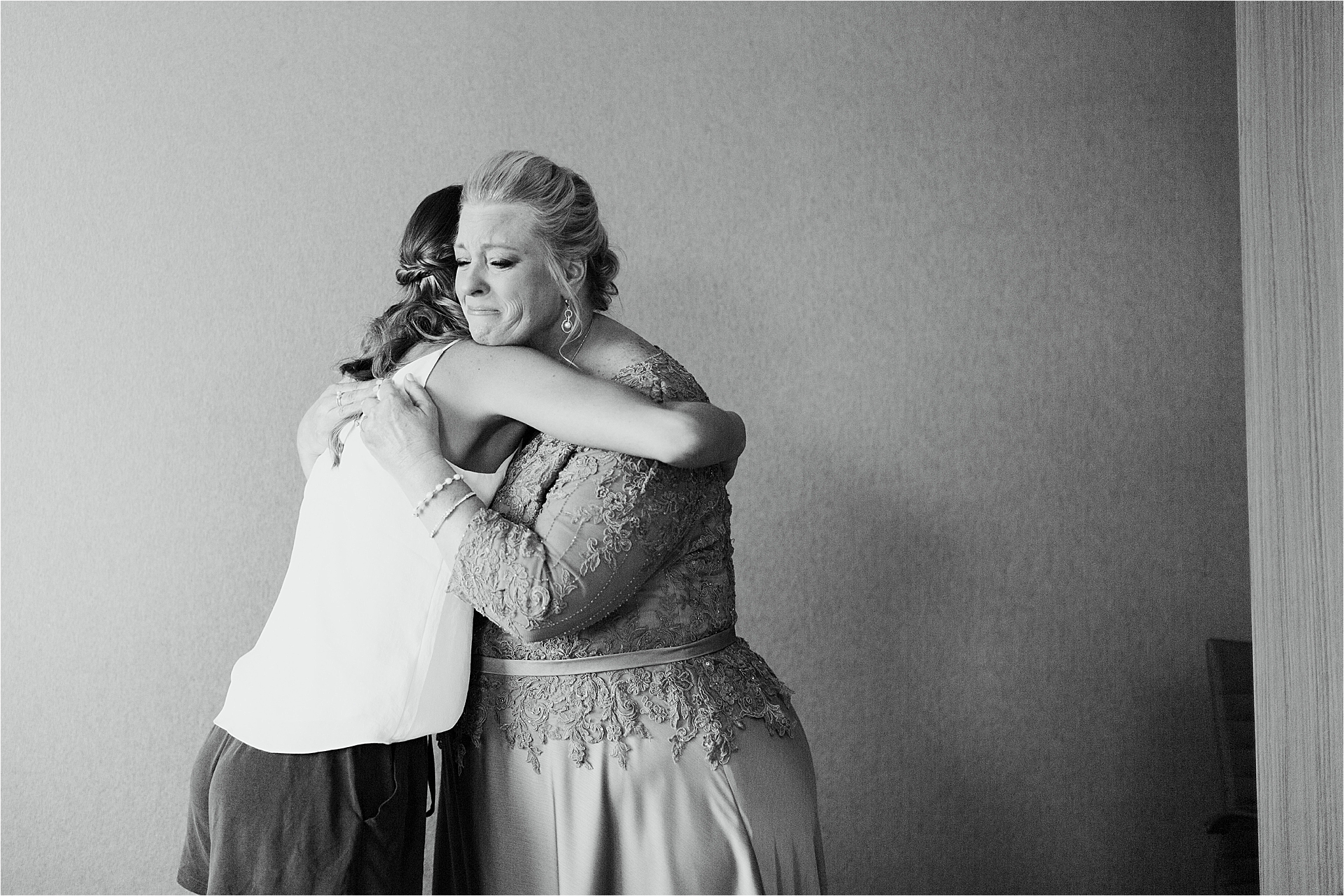 Mom and Bride crying and hugging before Cleveland wedding