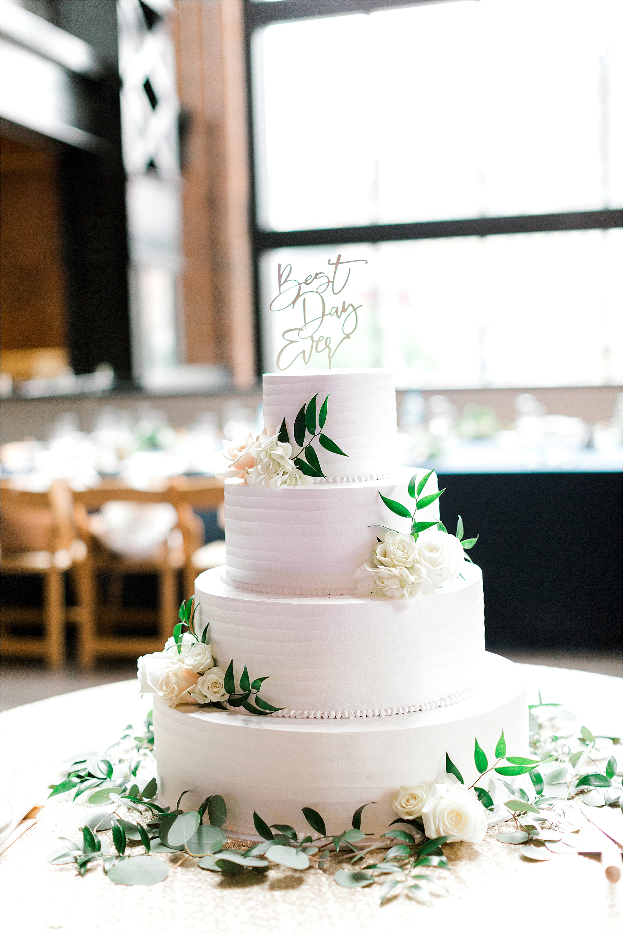 simple and elegant white cake with floral by Wild Flour Bakery in Cleveland