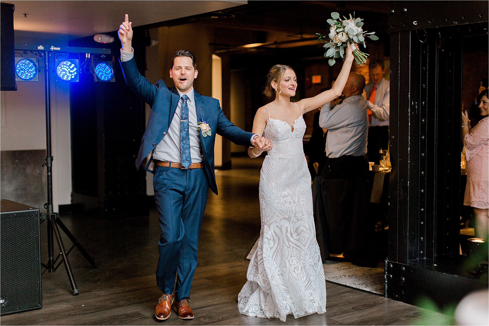 Hayley Paige Bride and groom dancing into their reception at Windows on the River