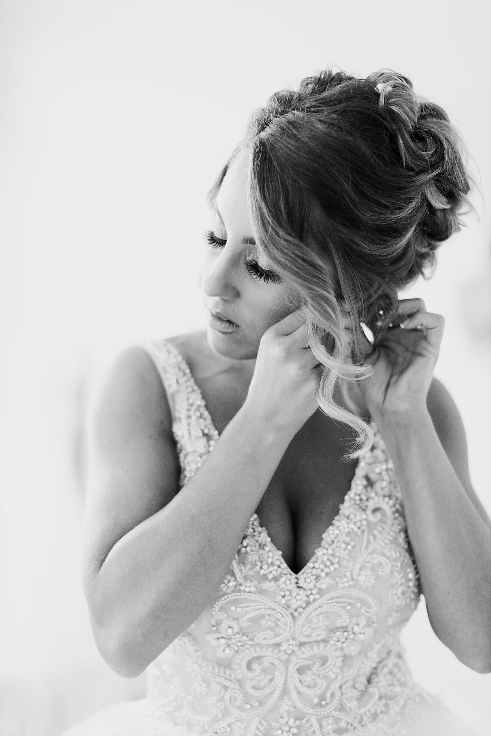 black and white photo of bride getting ready before wedding
