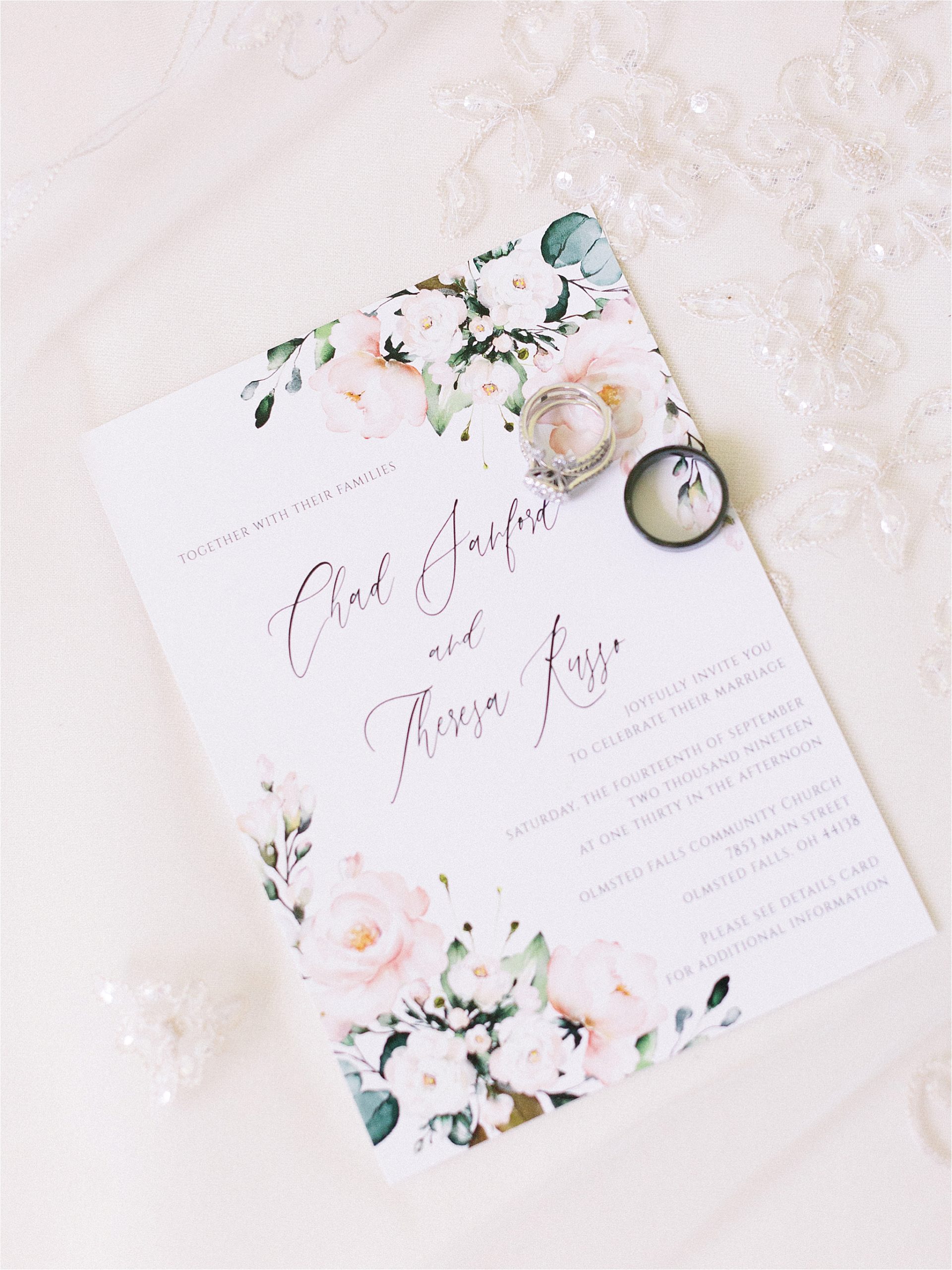 floral wedding invitation with pink and greenery