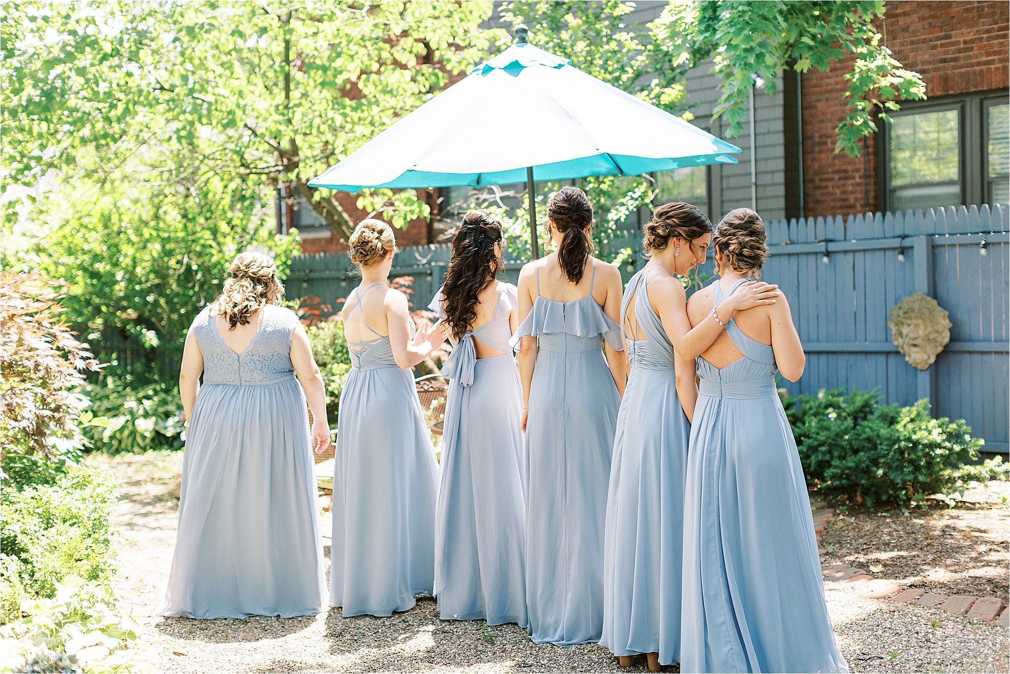 Bridesmaids in blue first look with bride