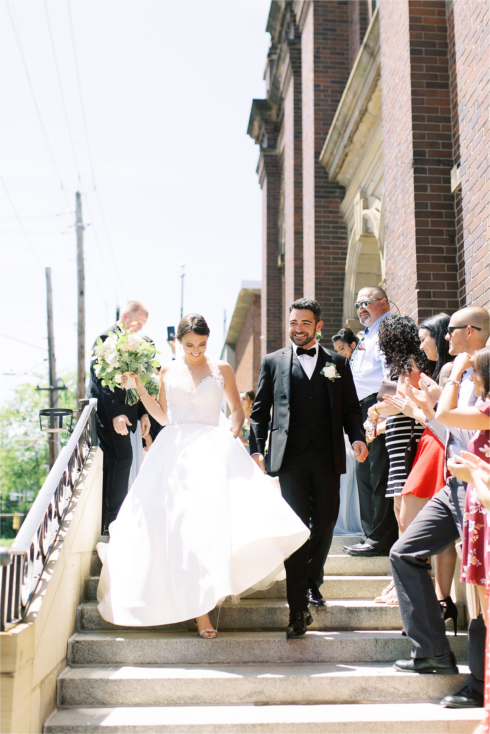 Bride & Groom exit little italy catholic church in Cleveland