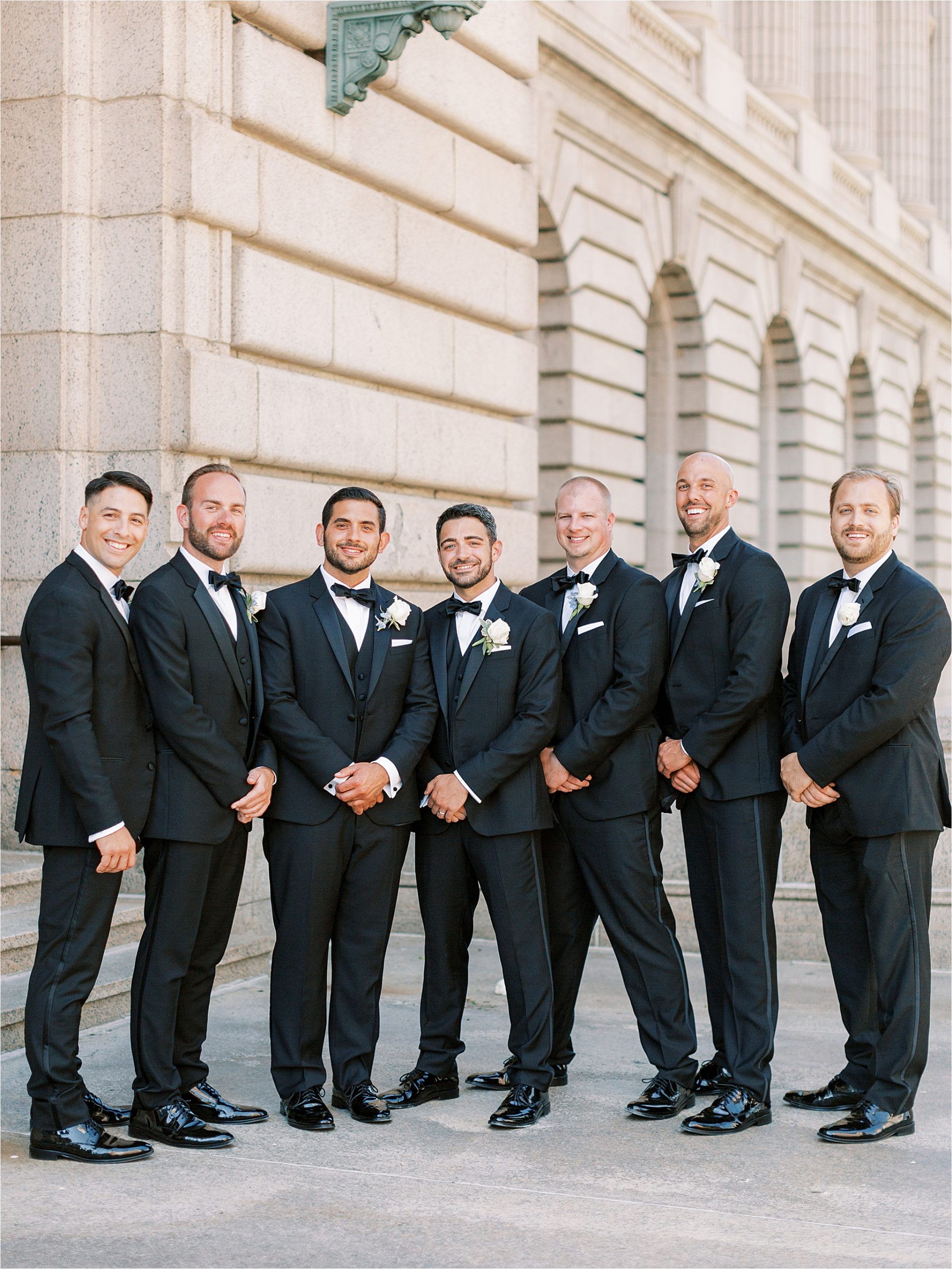 Groom and groomsmen wearing the Black Tux 