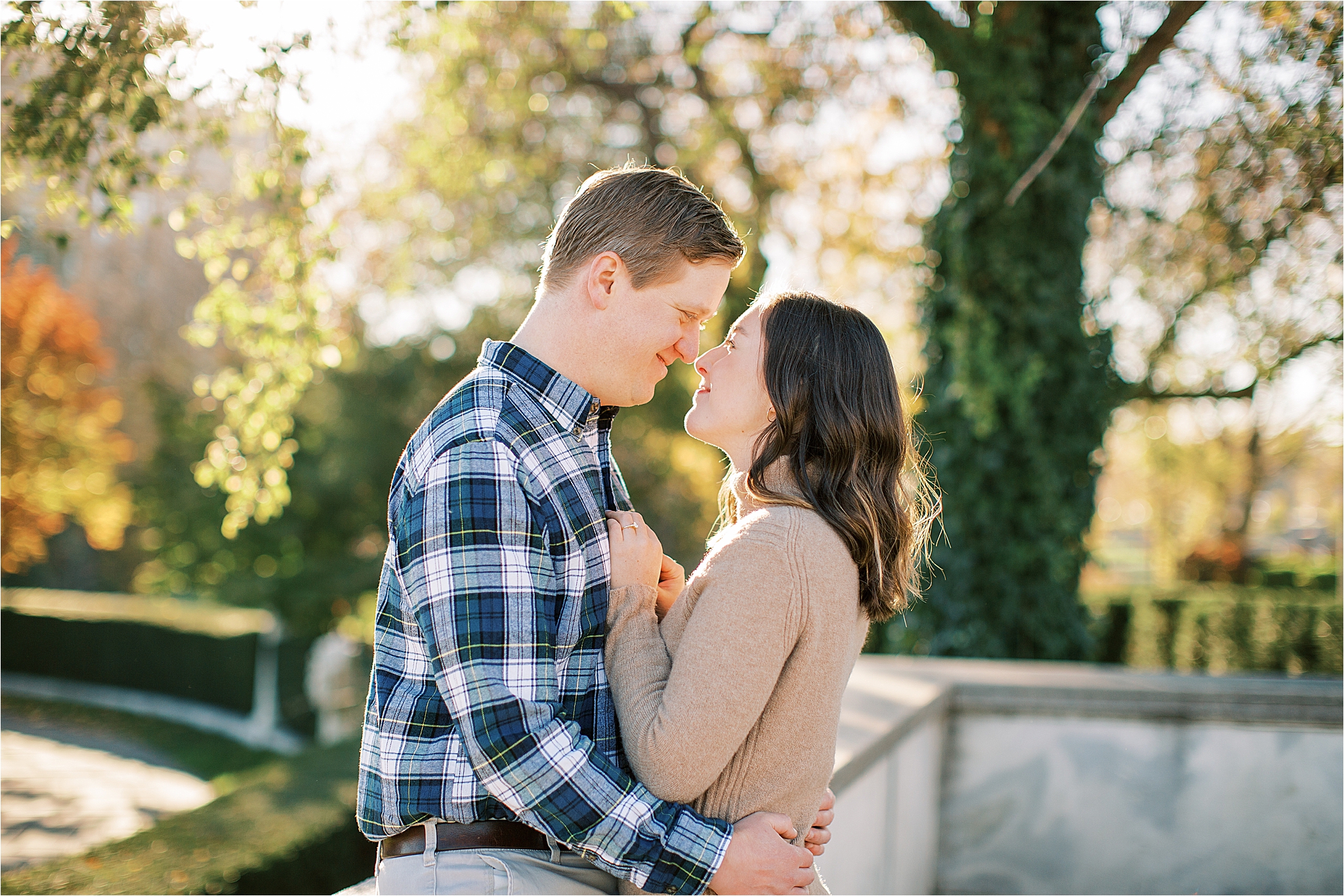 couple kissing during fall engagement session