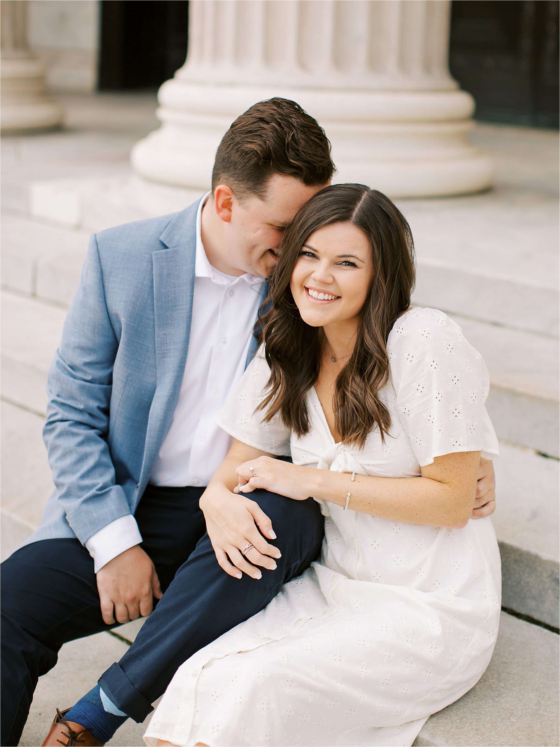 couple sitting on stairs at fine art engagement session in Cleveland