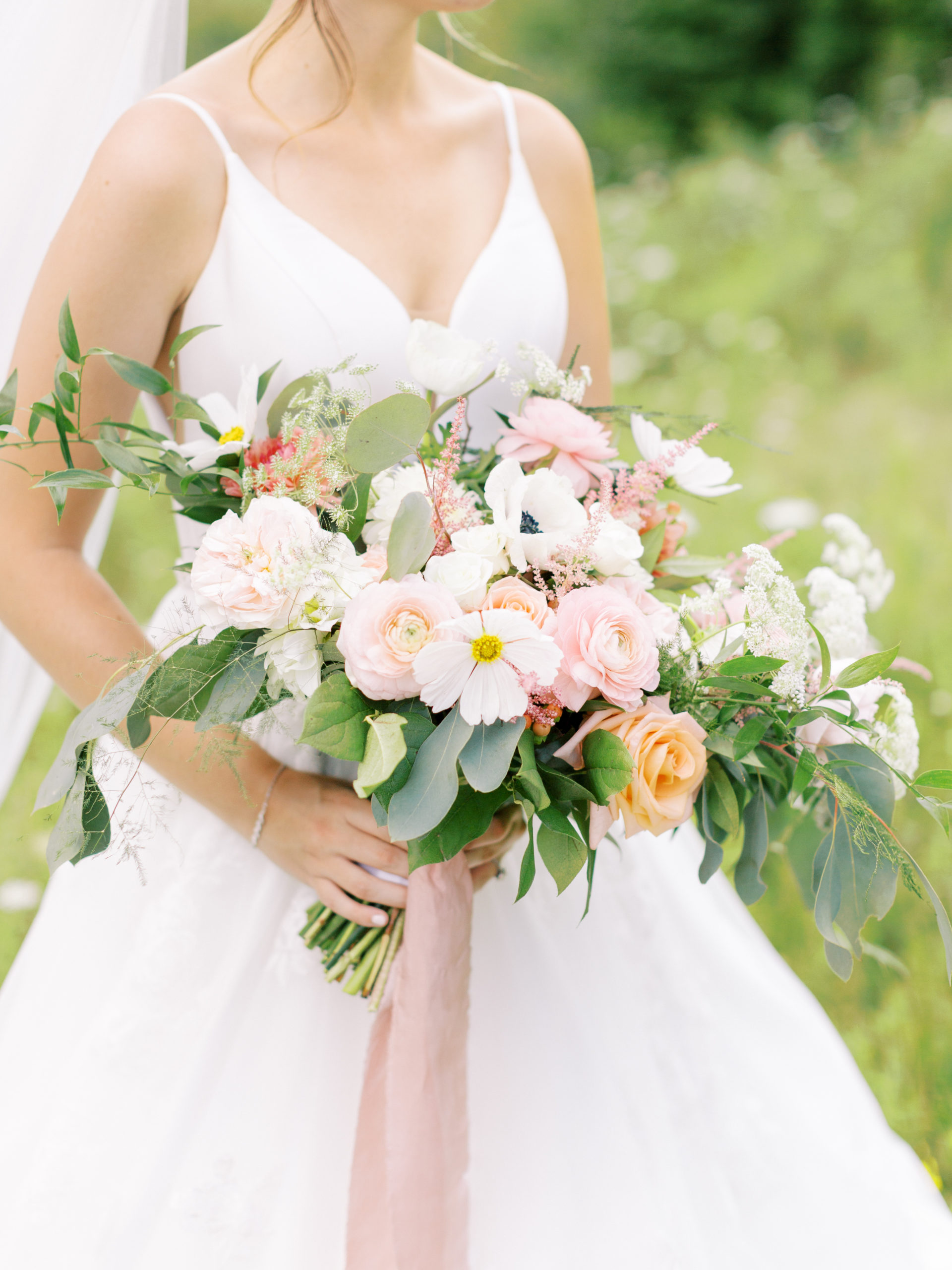 large whimsical pink orange and white bouquet with greenery by dietz floral 