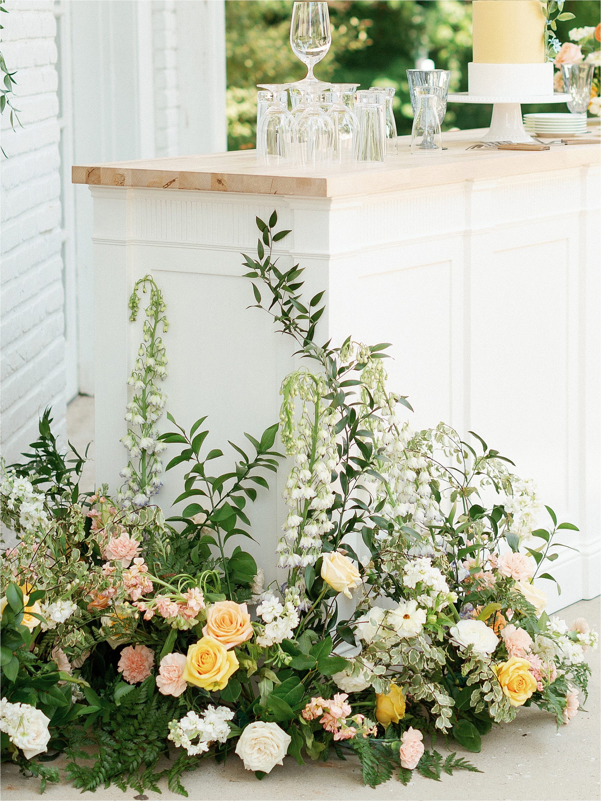 white Wedding bar with peach and white and greenery