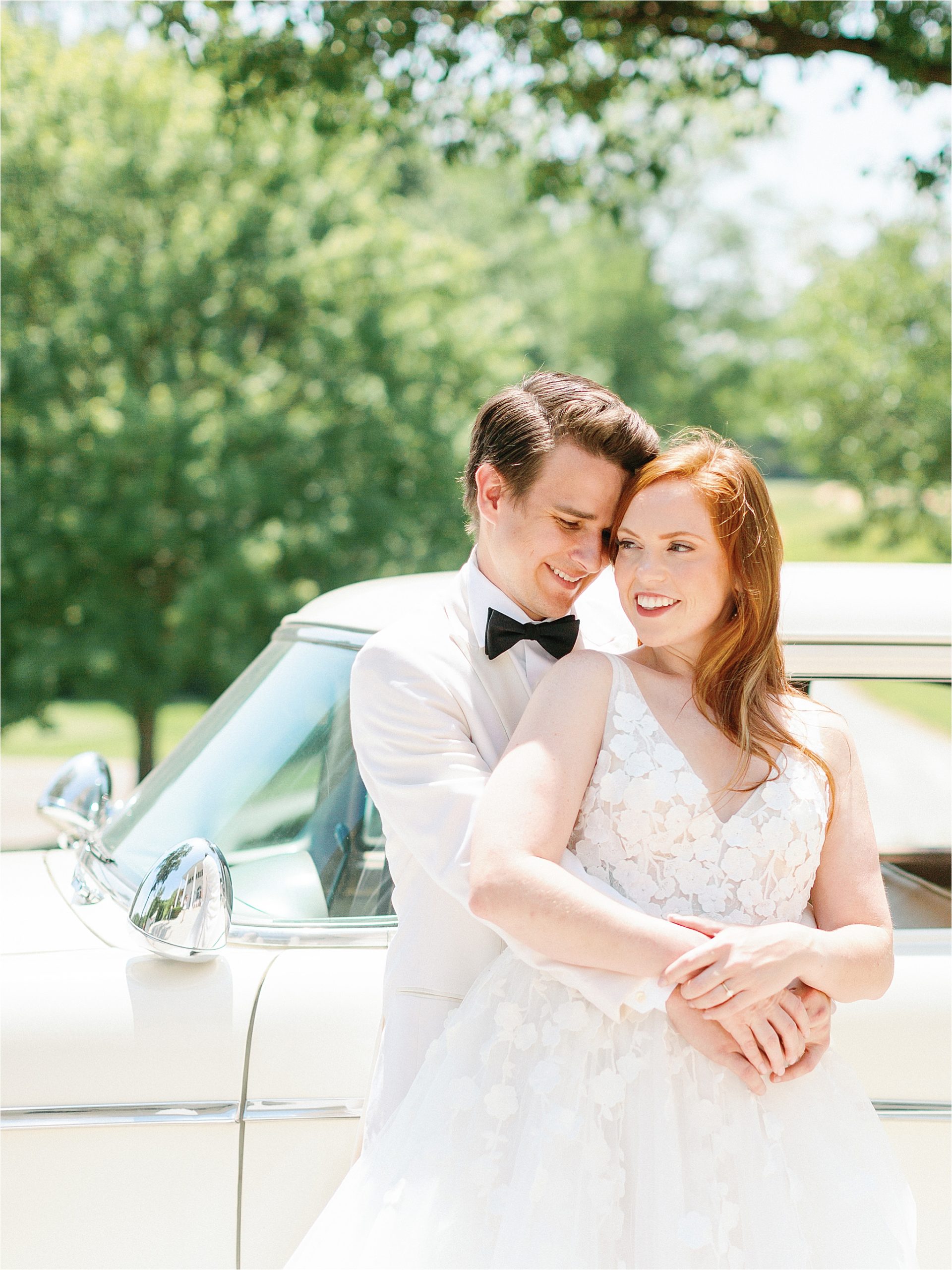 wedding couple standing in front of vintage car at estate wedding