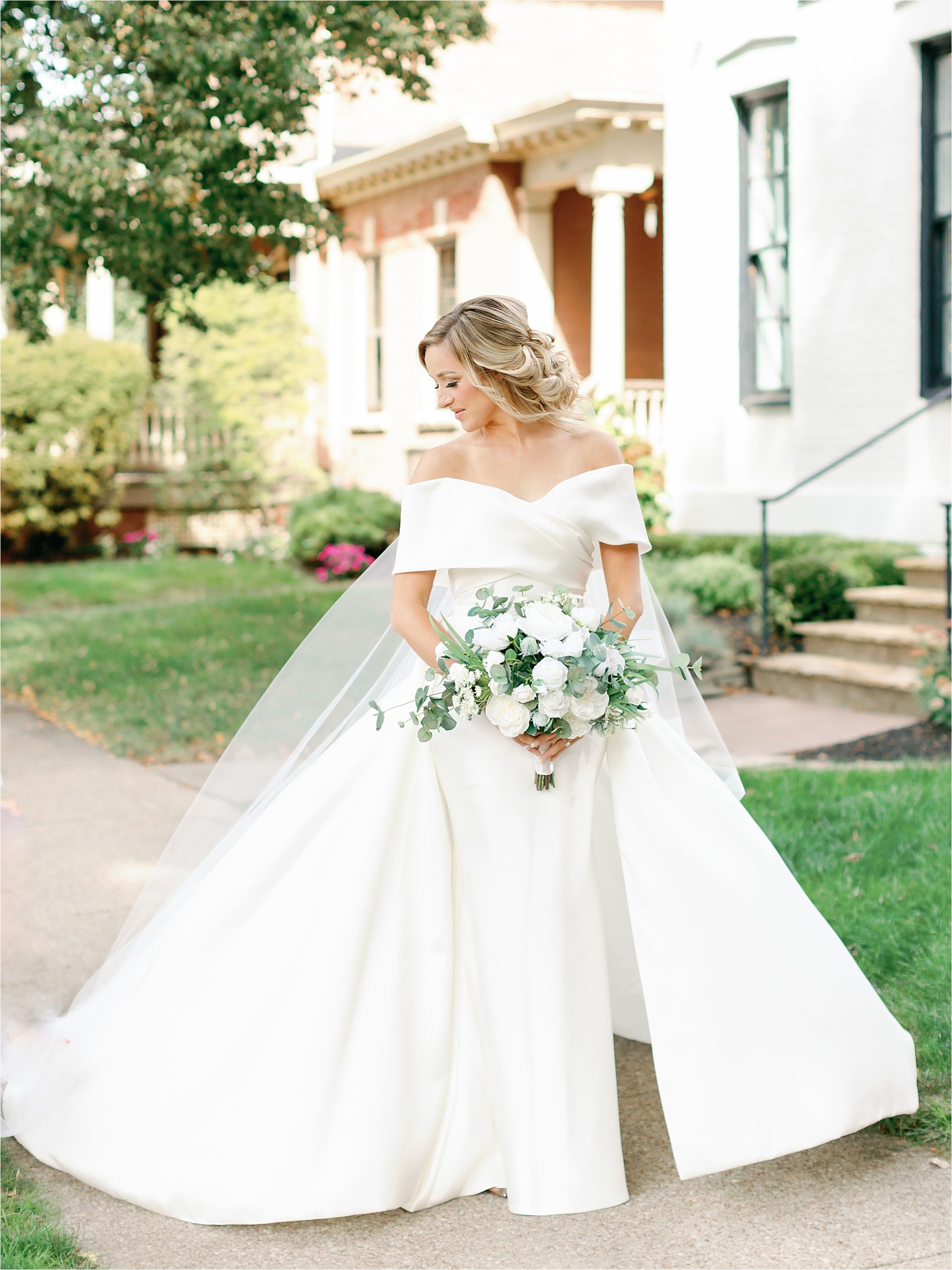 bride wearing simple dress with detachable skirt