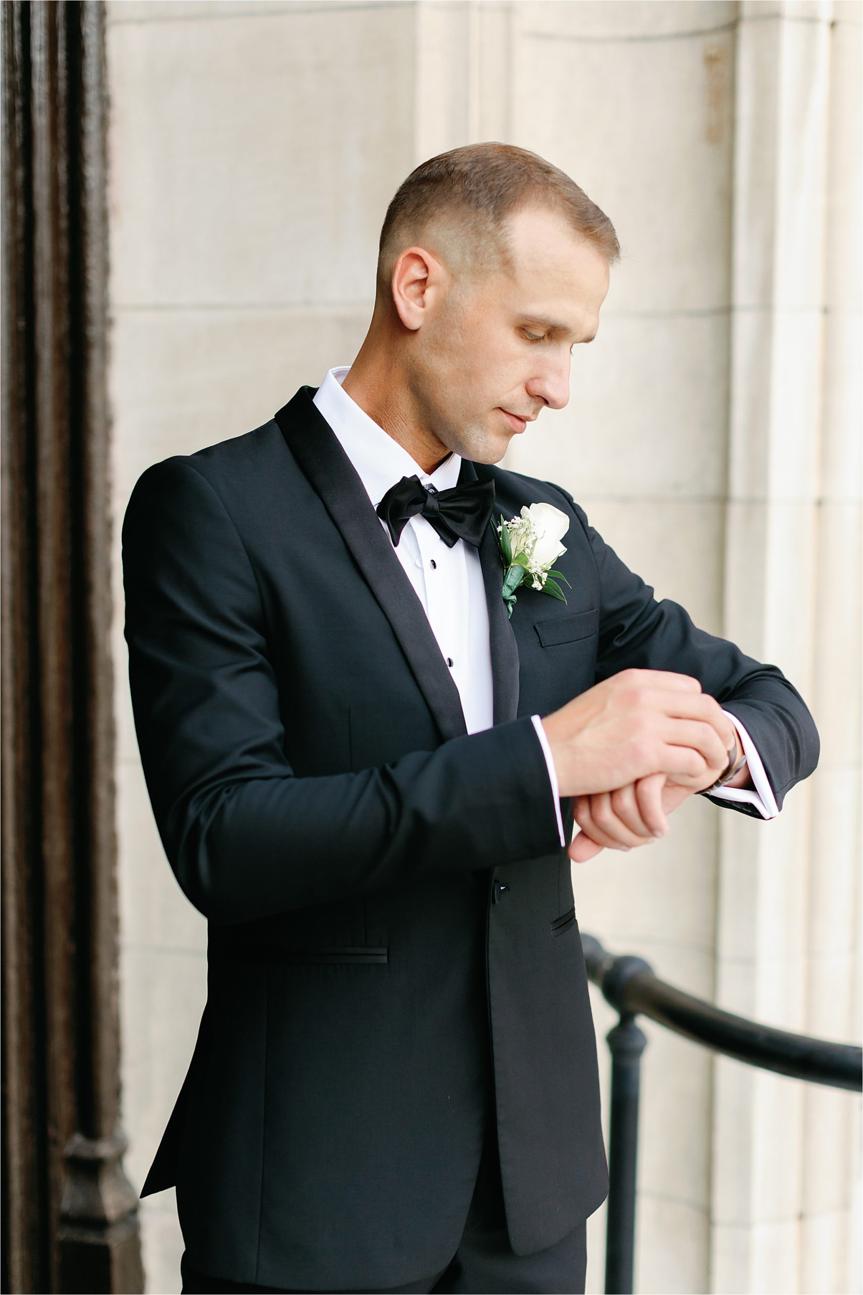 Groom gets dressed into tuxedo for Buffalo NY wedding